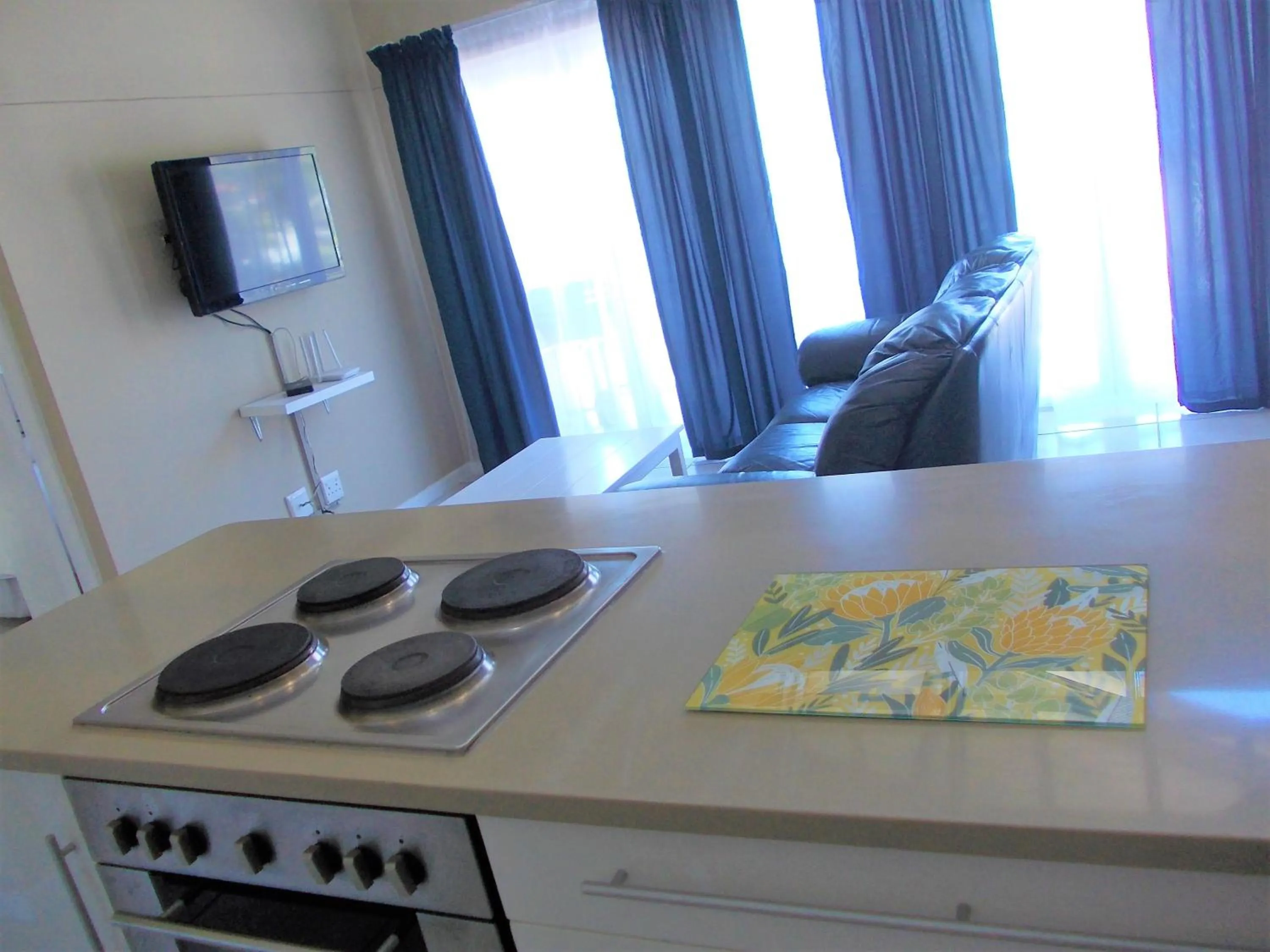 Kitchen or kitchenette, TV/Entertainment Center in Point Village Hotel and Self Catering