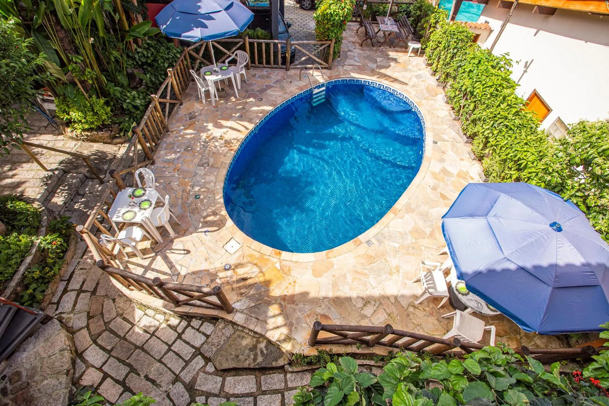 Swimming pool in Pousada Recanto da Villa