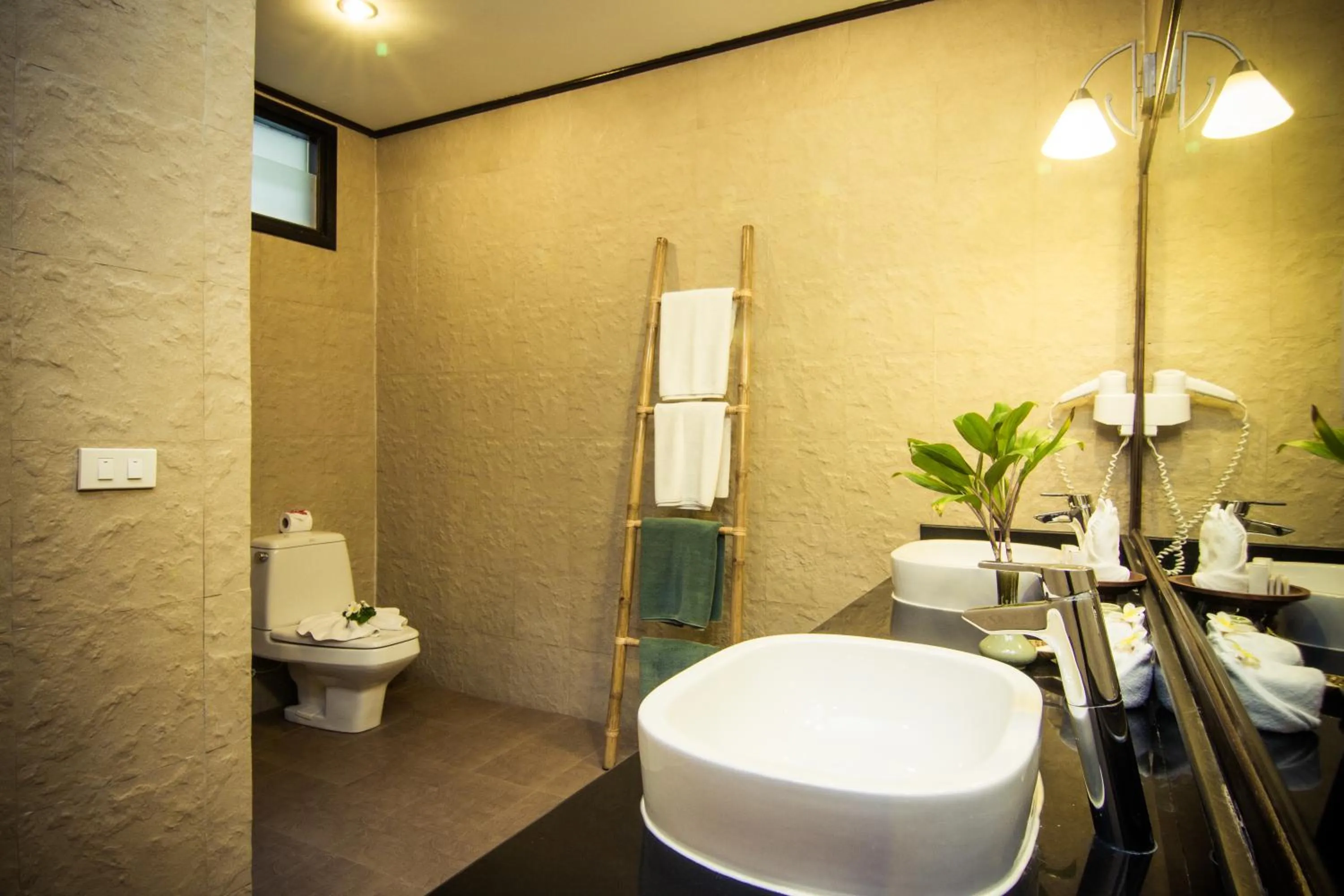 Toilet in Coco Palm Beach Resort - SHA Extra Plus