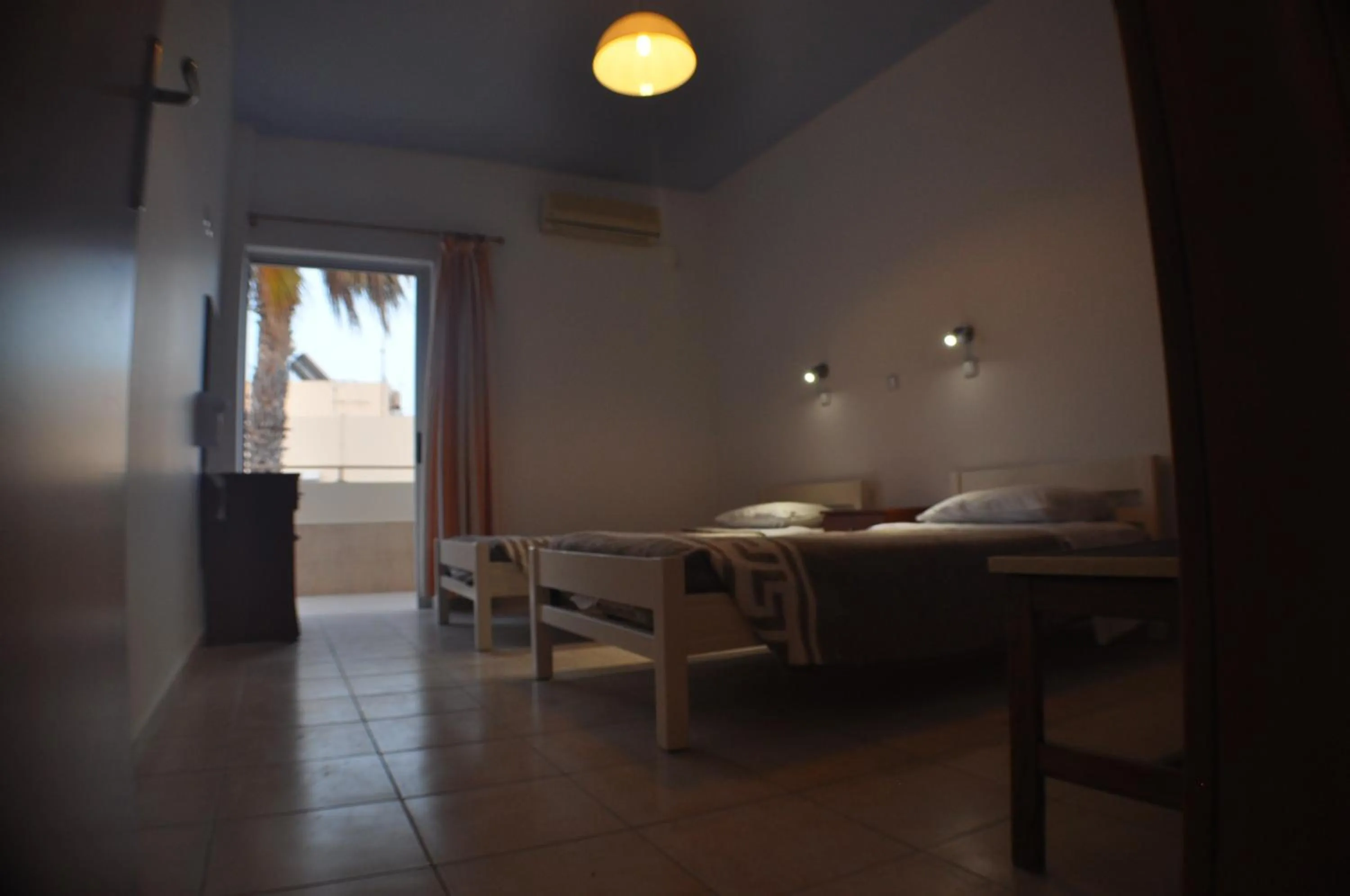 Bed in Zouboulia Apartments