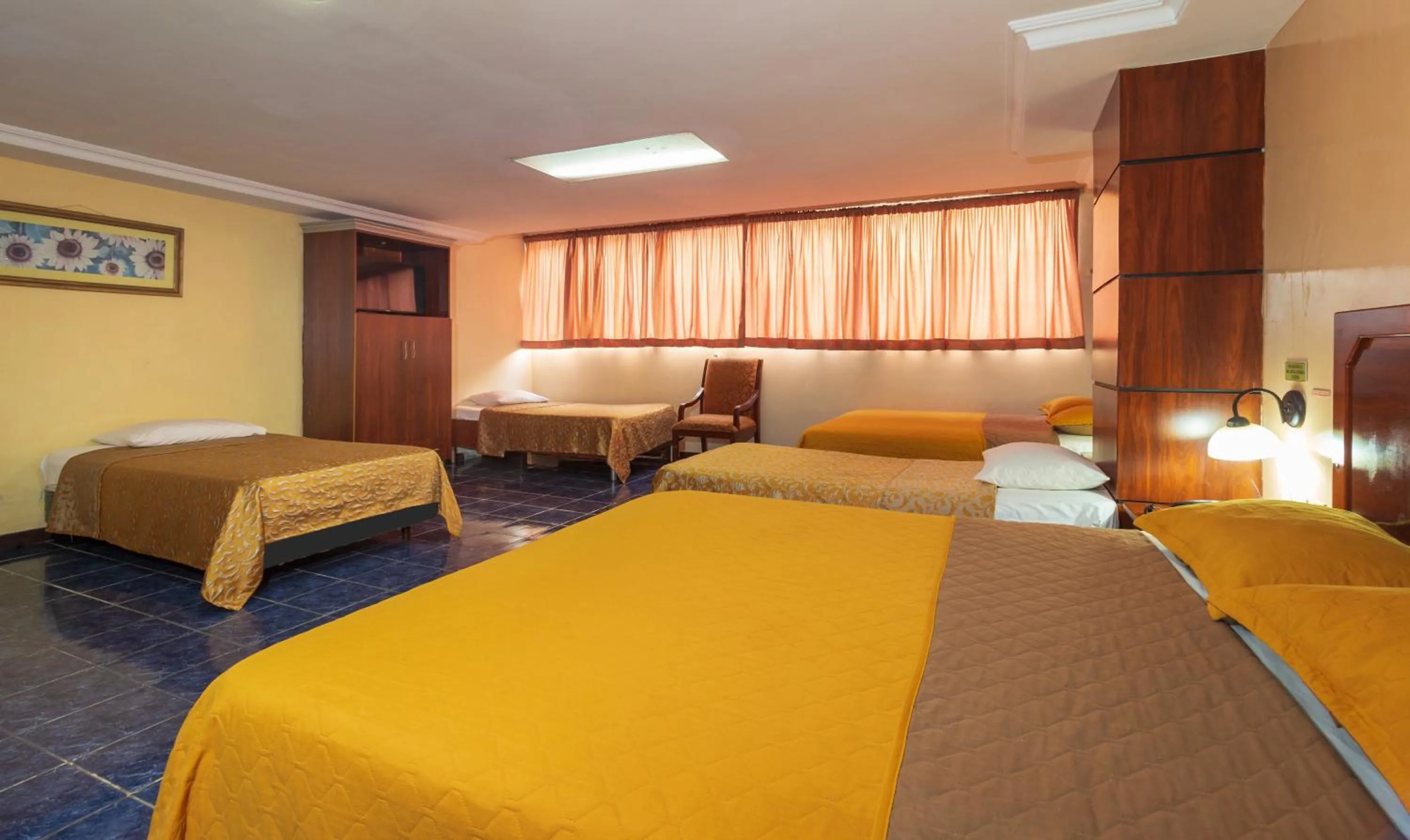 Photo of the whole room, Bed in Hotel Malecon Inn