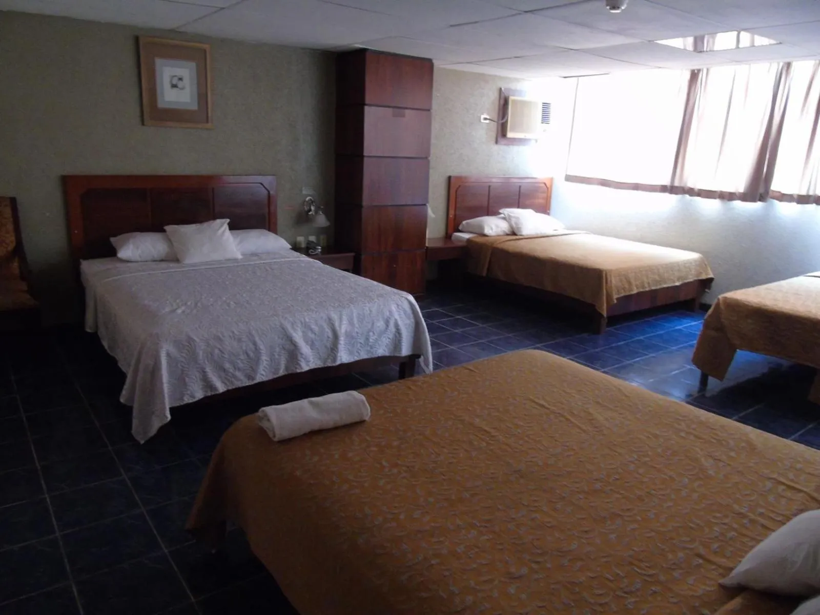 Photo of the whole room, Bed in Hotel Malecon Inn