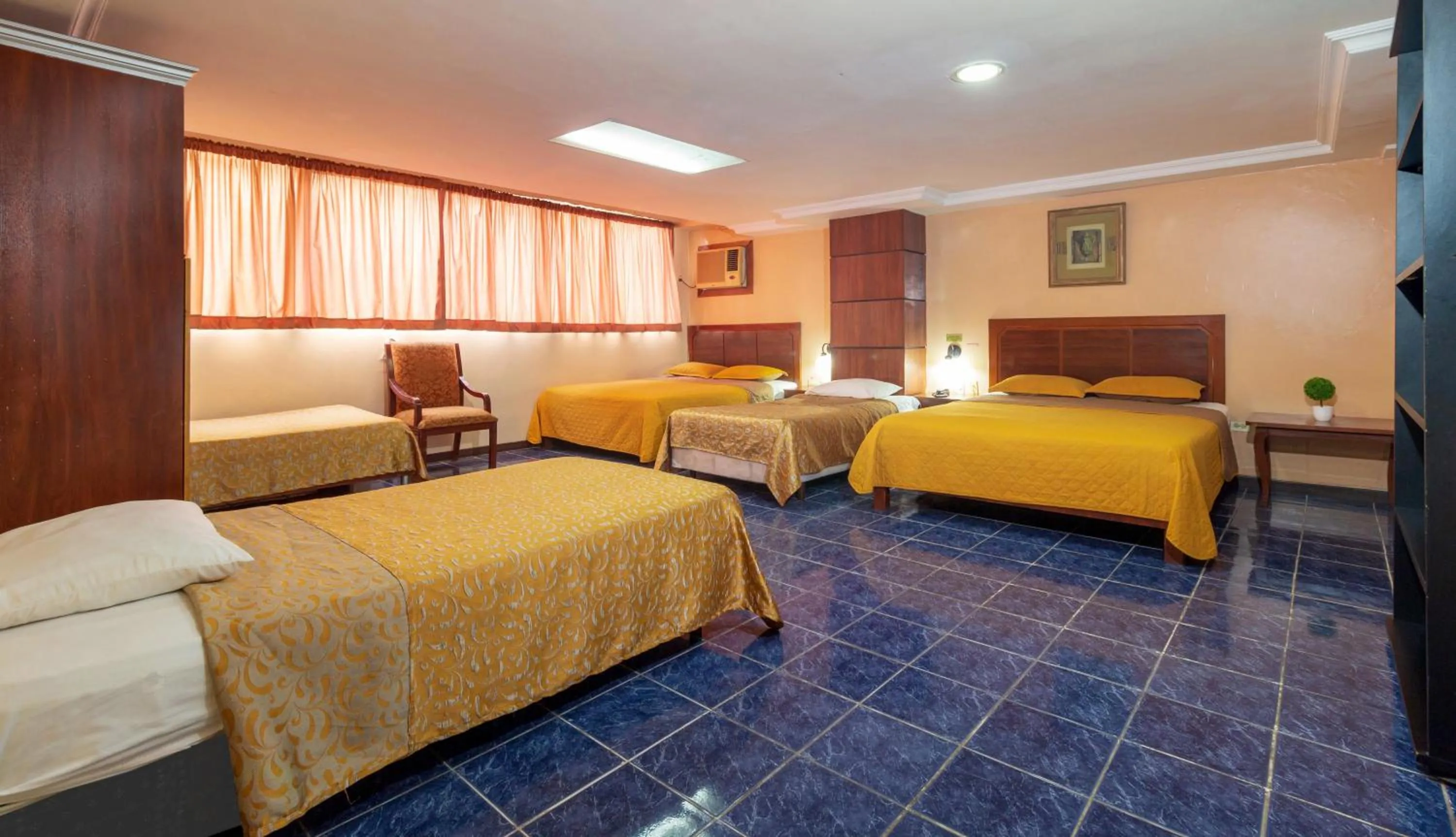 Photo of the whole room, Bed in Hotel Malecon Inn