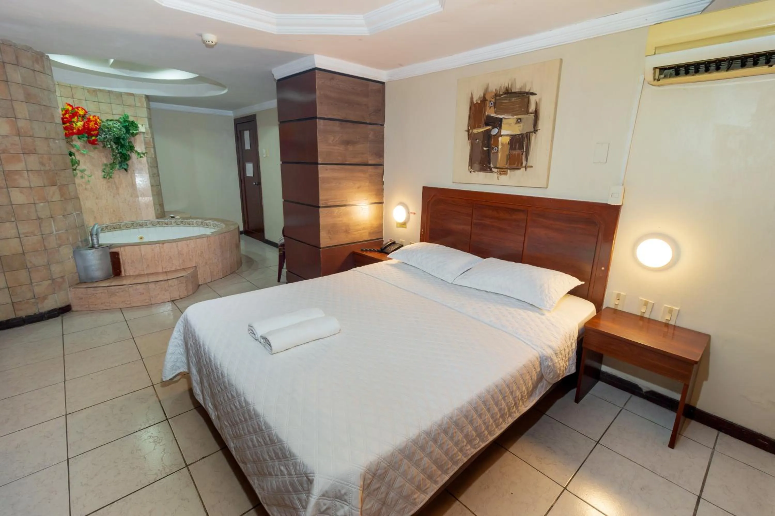 Bed in Hotel Malecon Inn