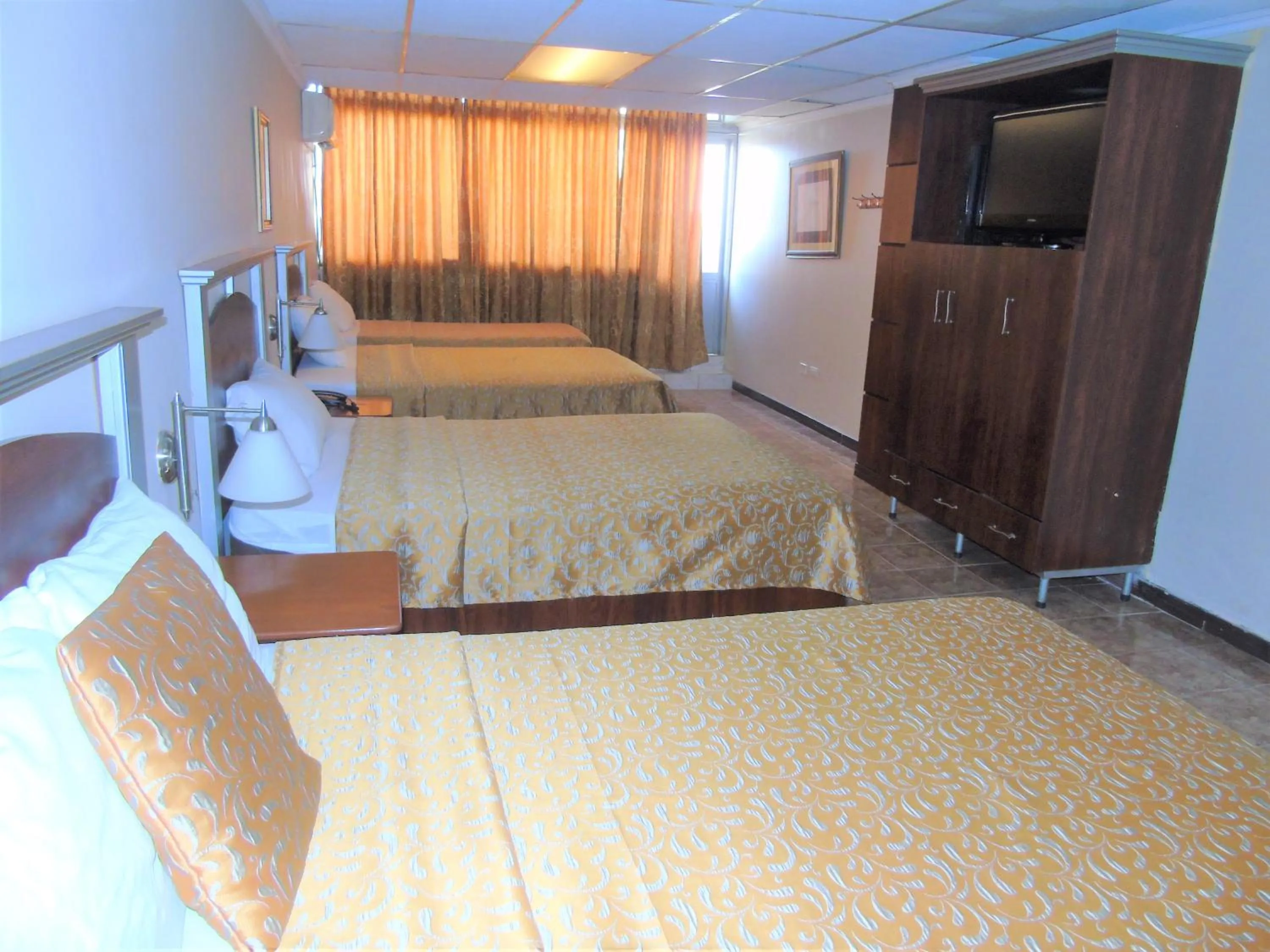 Photo of the whole room, Bed in Hotel Malecon Inn