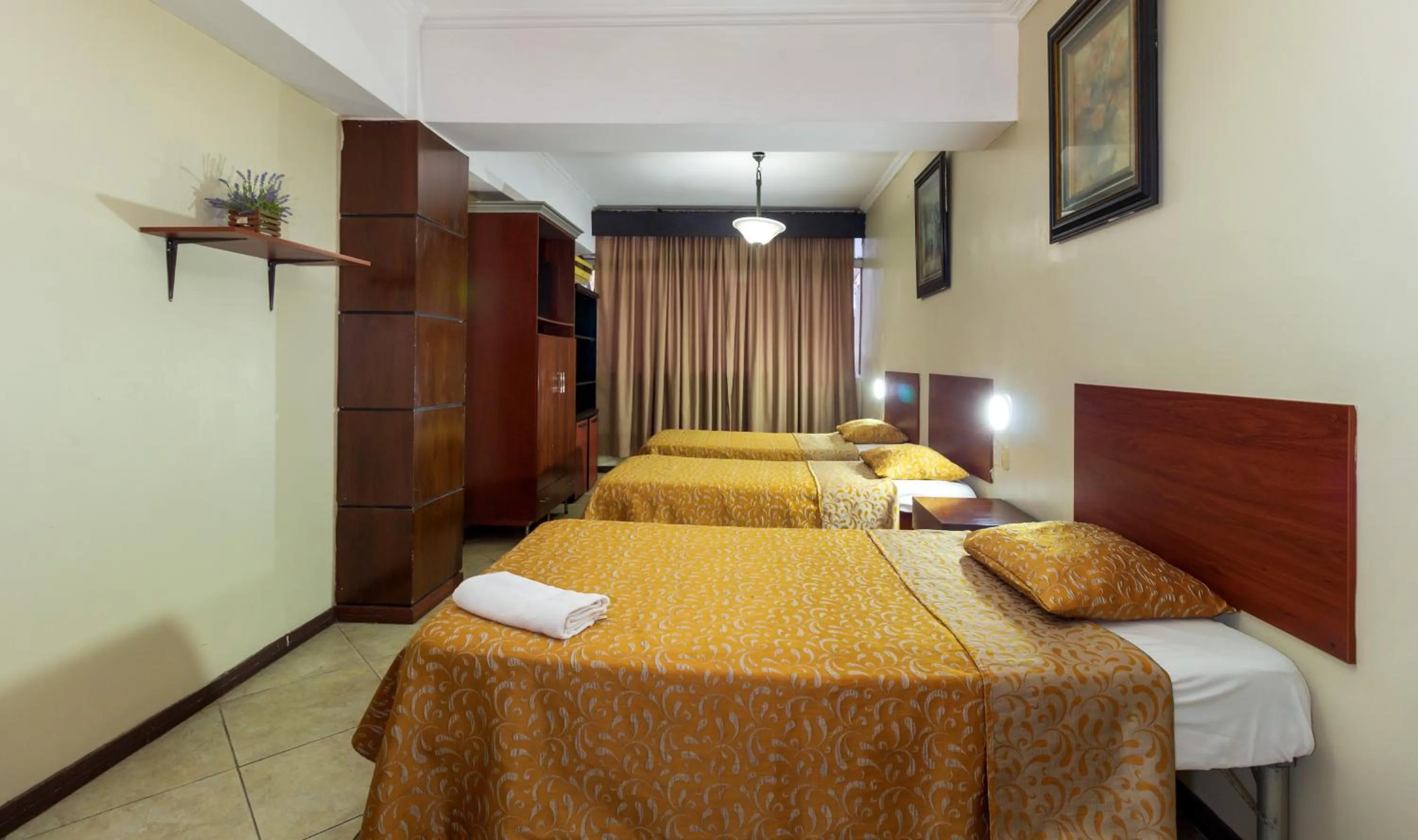 Photo of the whole room, Bed in Hotel Malecon Inn