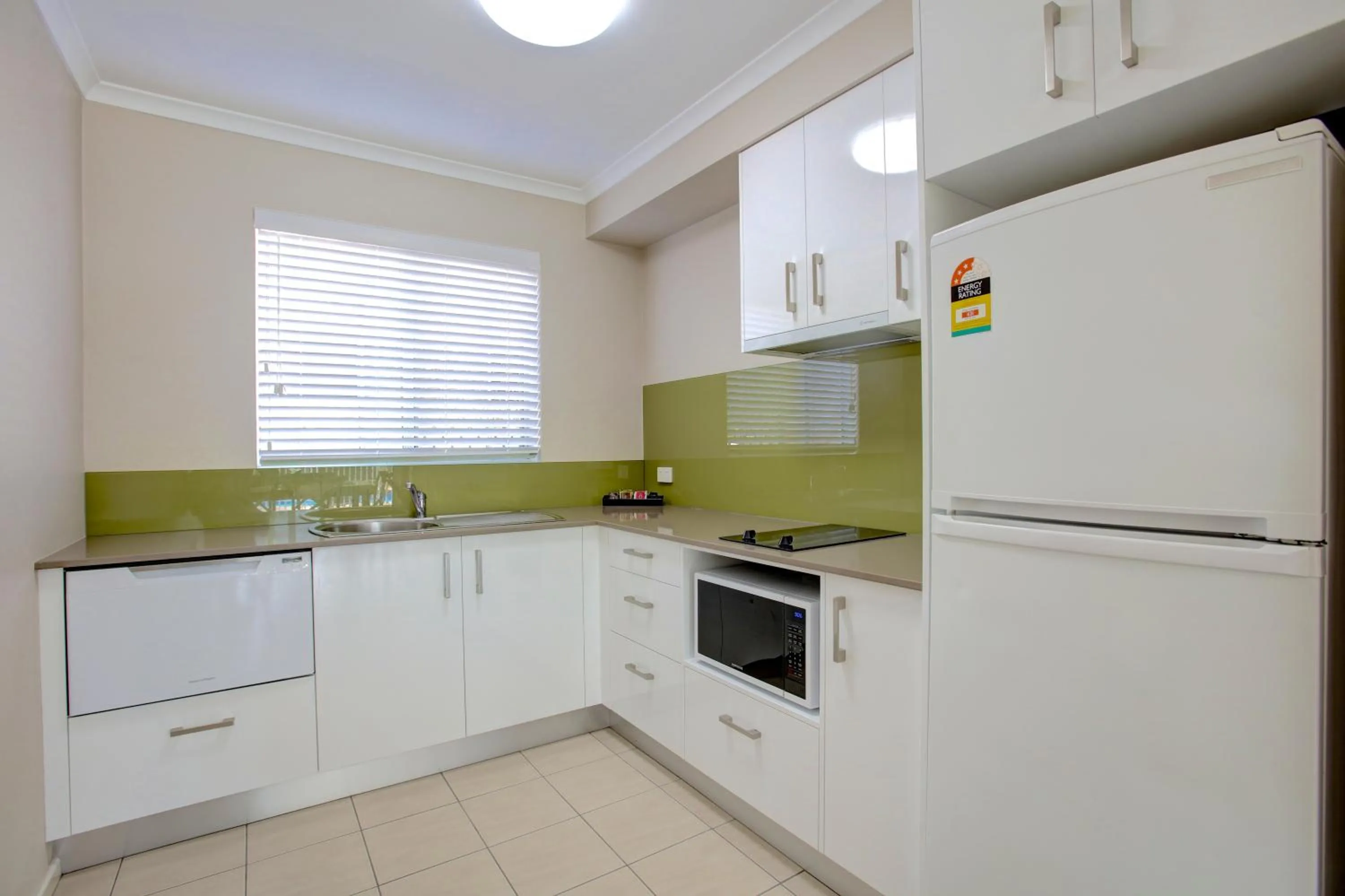 Kitchen or kitchenette in Beachpark Apartments Coffs Harbour