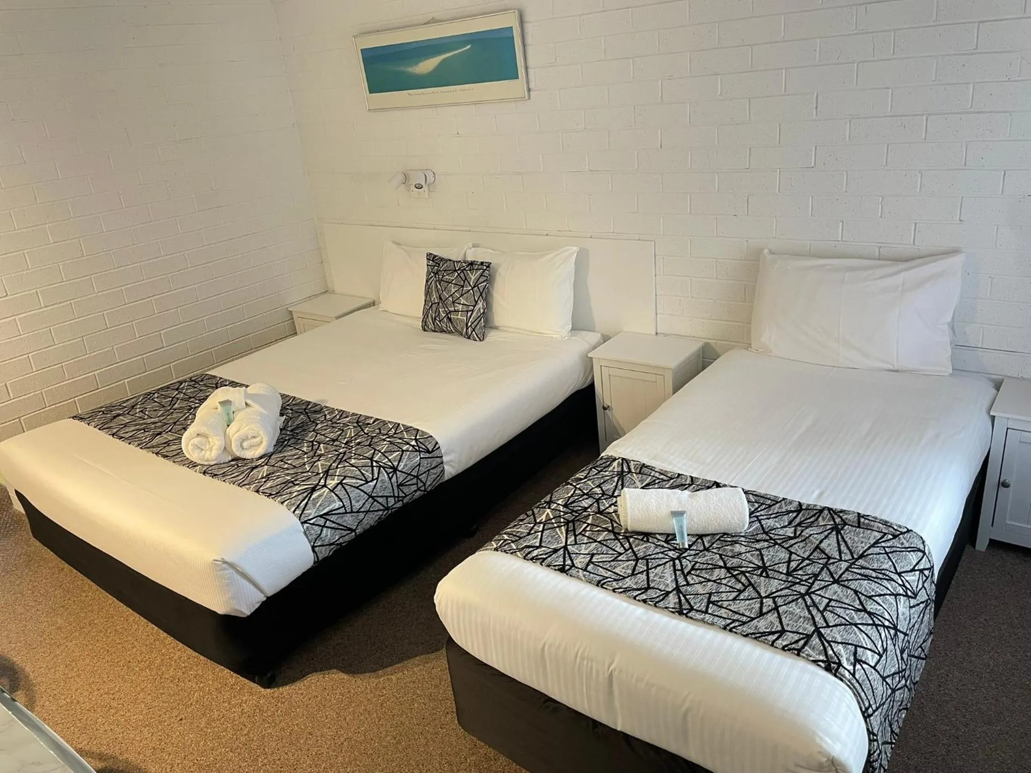 Bed in Coastal Bay Motel