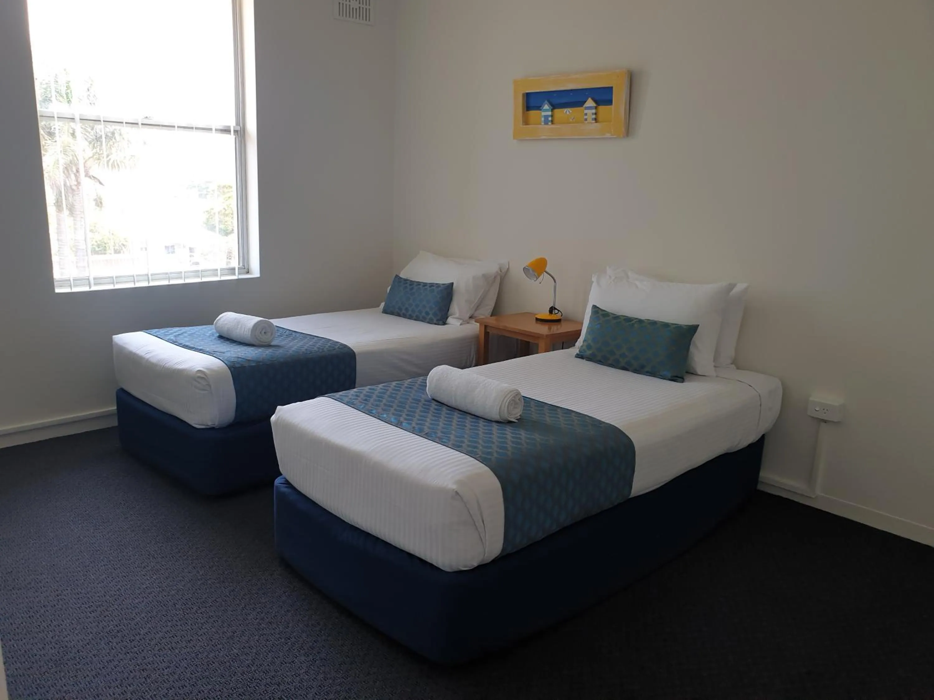 Bed in Oxley Cove Holiday Apartment