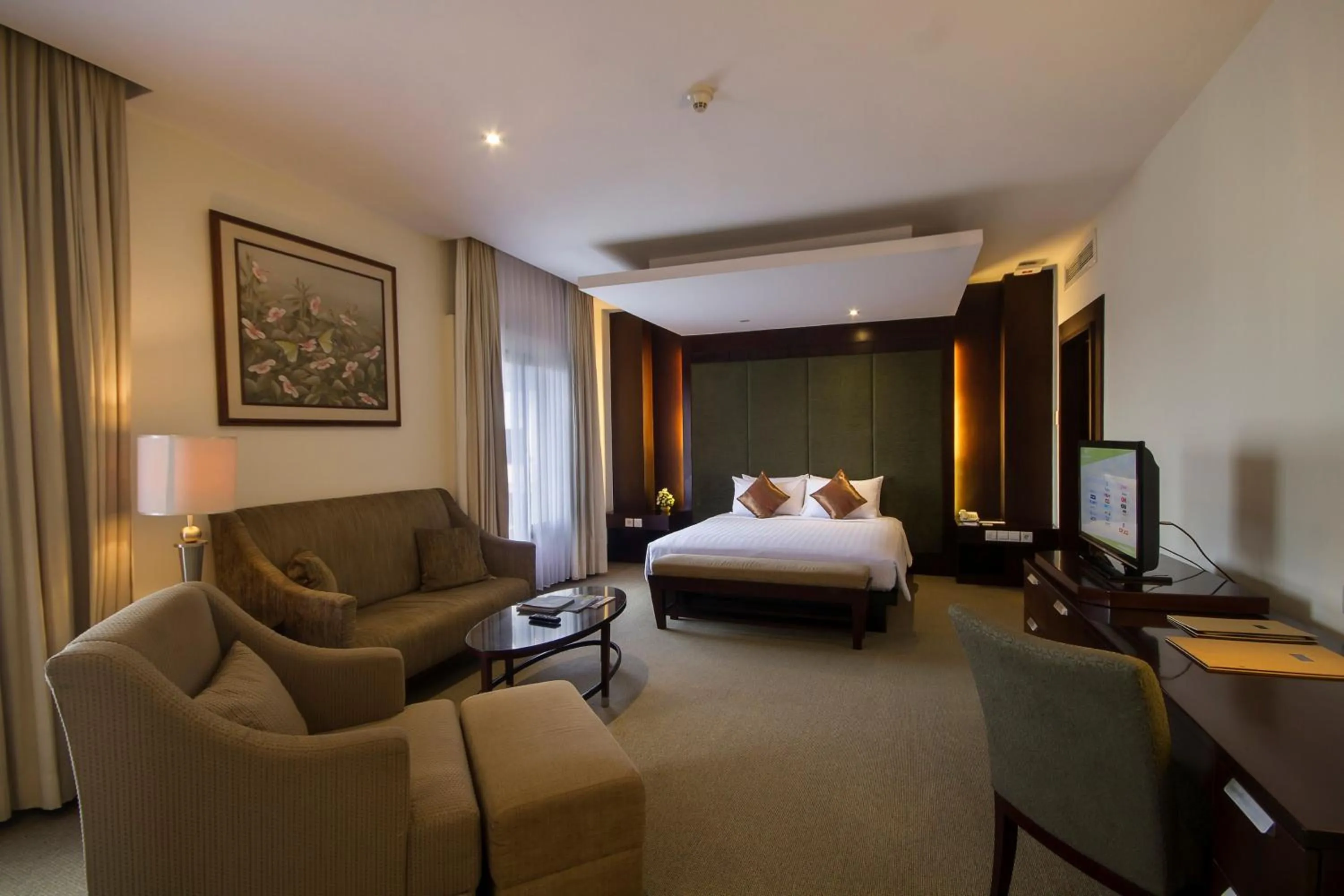 Seating area, Bed in Hotel Santika Cirebon