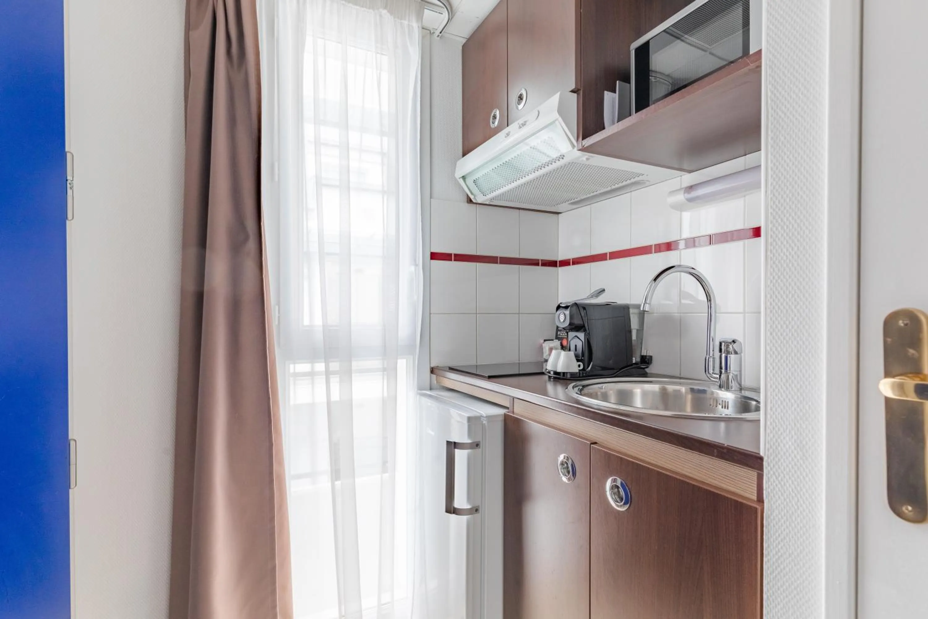 Kitchen or kitchenette in Appart'City Confort Pau Centre