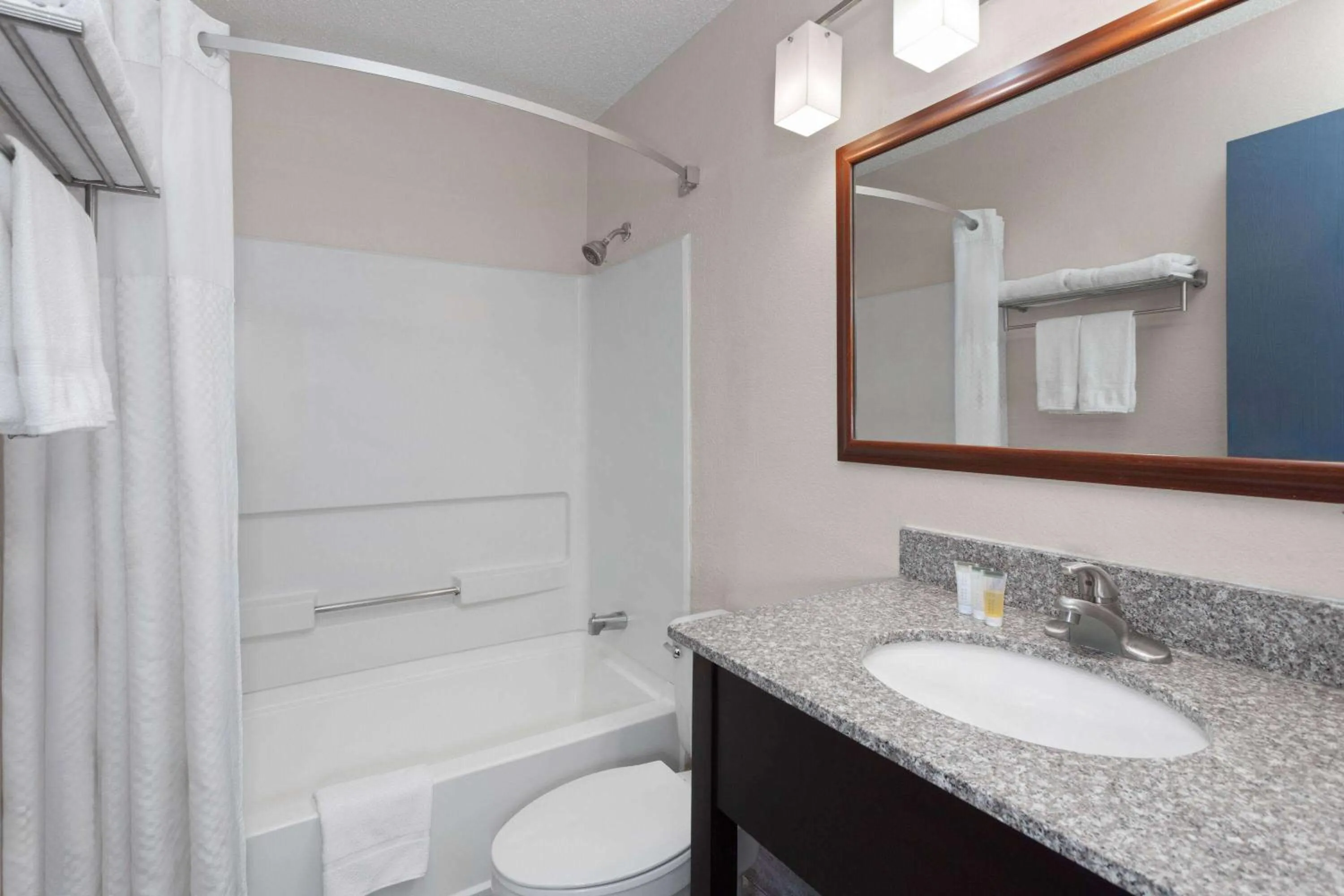 Bathroom in Super 8 by Wyndham Romeoville Bolingbrook