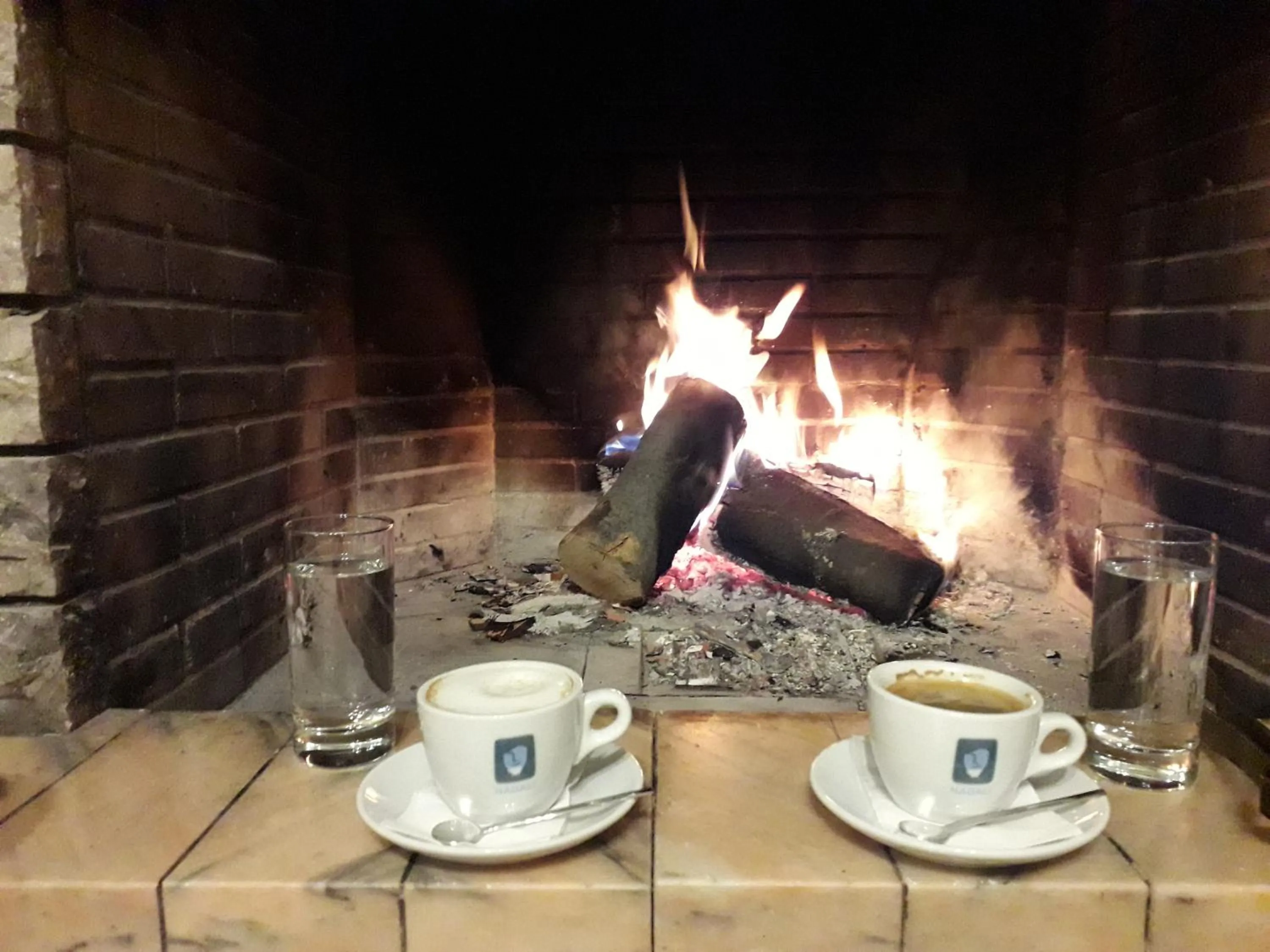 Communal lounge/ TV room in Olympus View Rooms Sauna & Spa