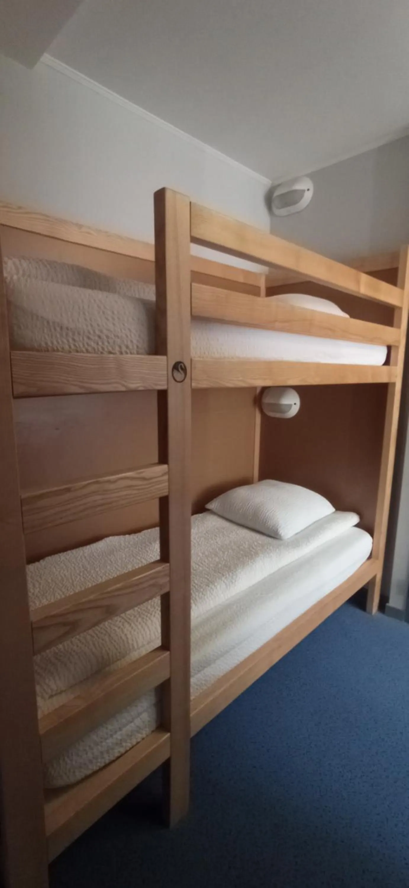 Bed in Logis Hotel Restaurant Le Cygne