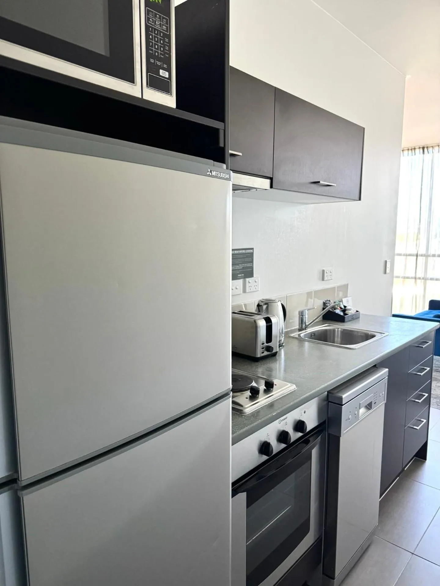 Kitchen or kitchenette in Quest Henderson, Auckland Apartment Hotel