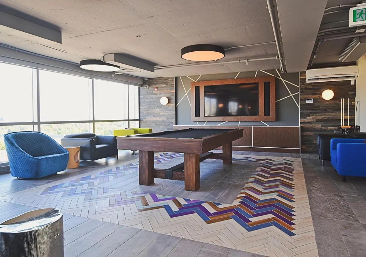 Communal lounge/ TV room in LIV Extended Stay