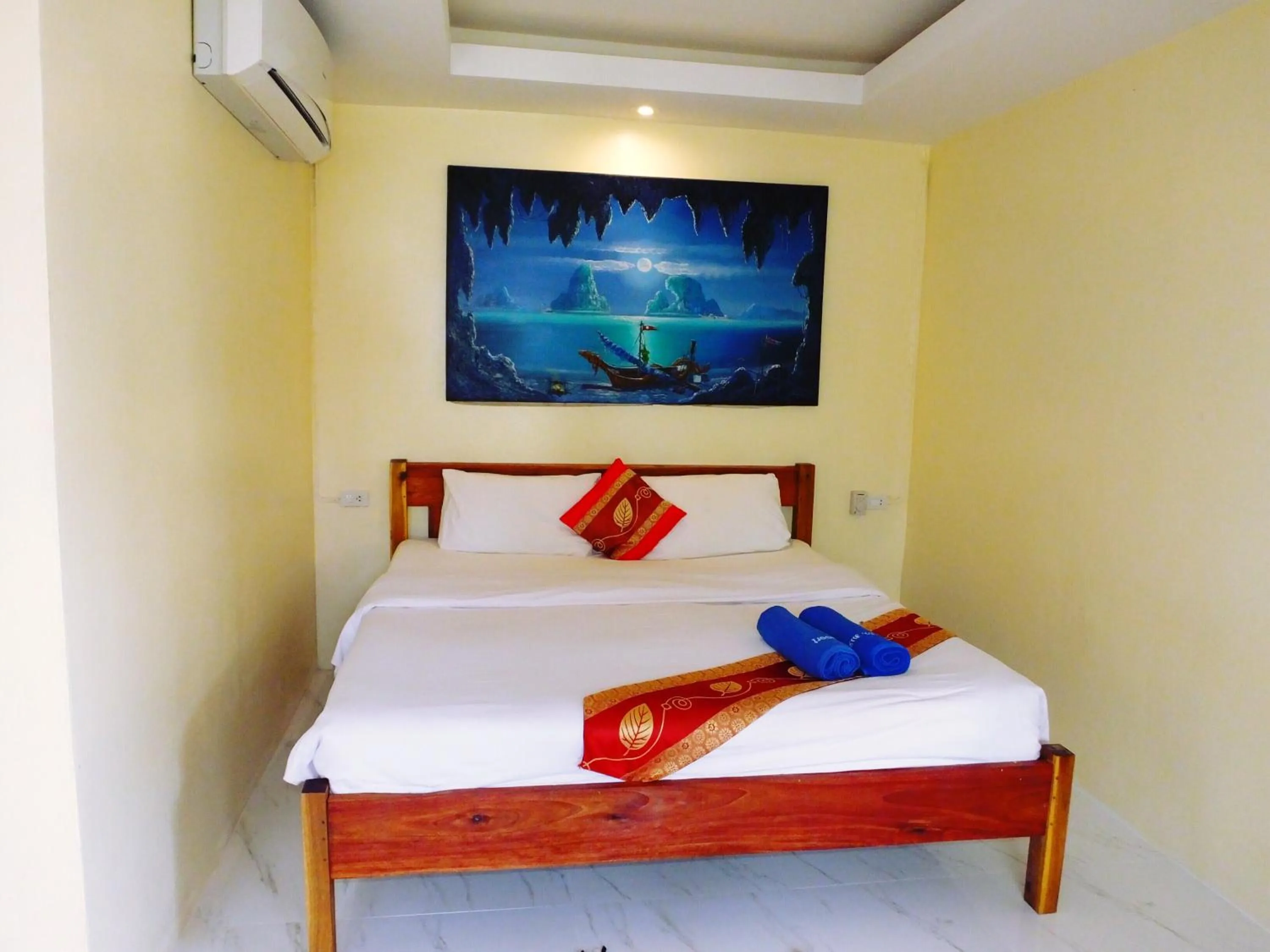 Bed in Blue Andaman Lanta Resort