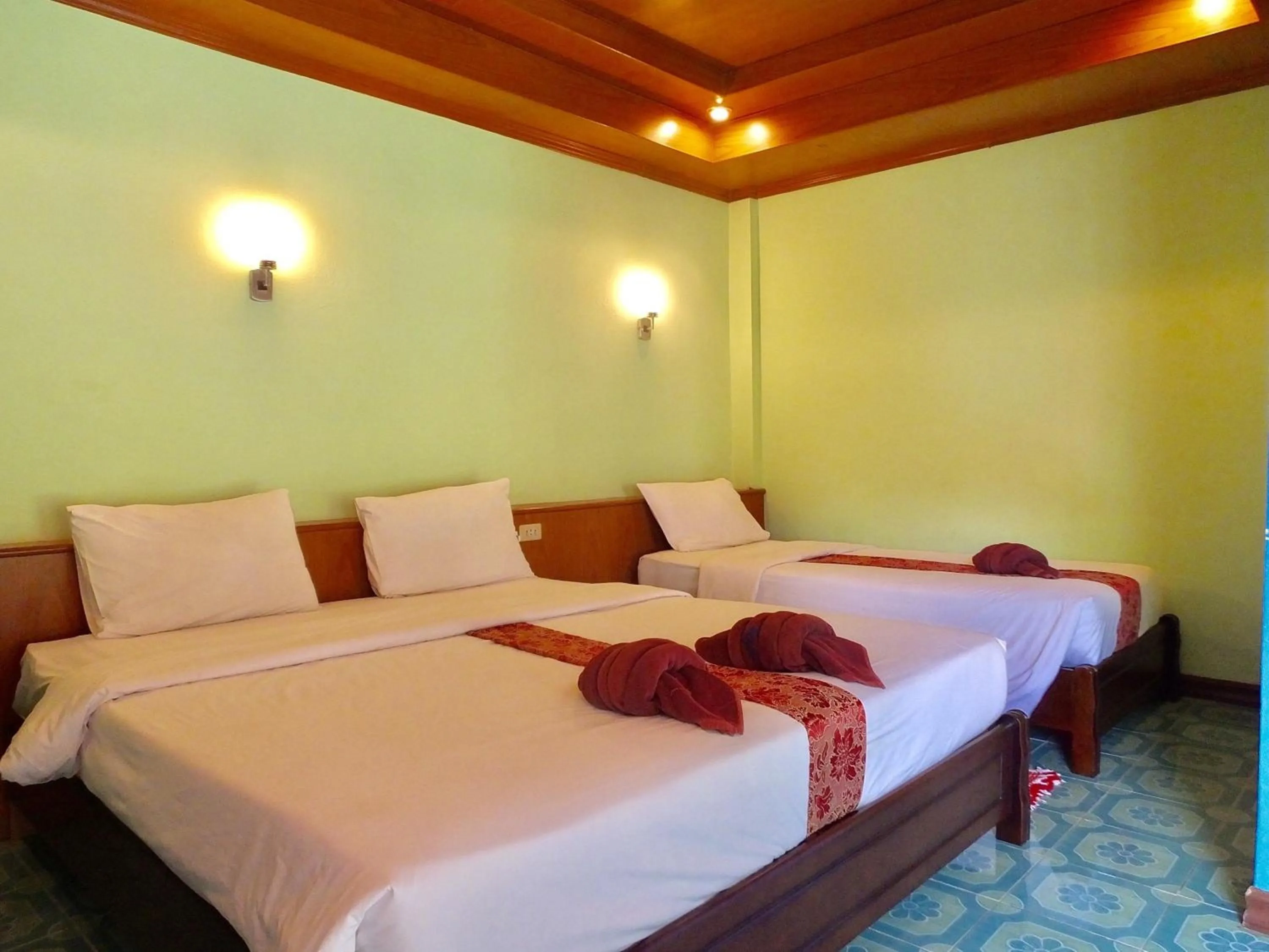 Bed in Blue Andaman Lanta Resort