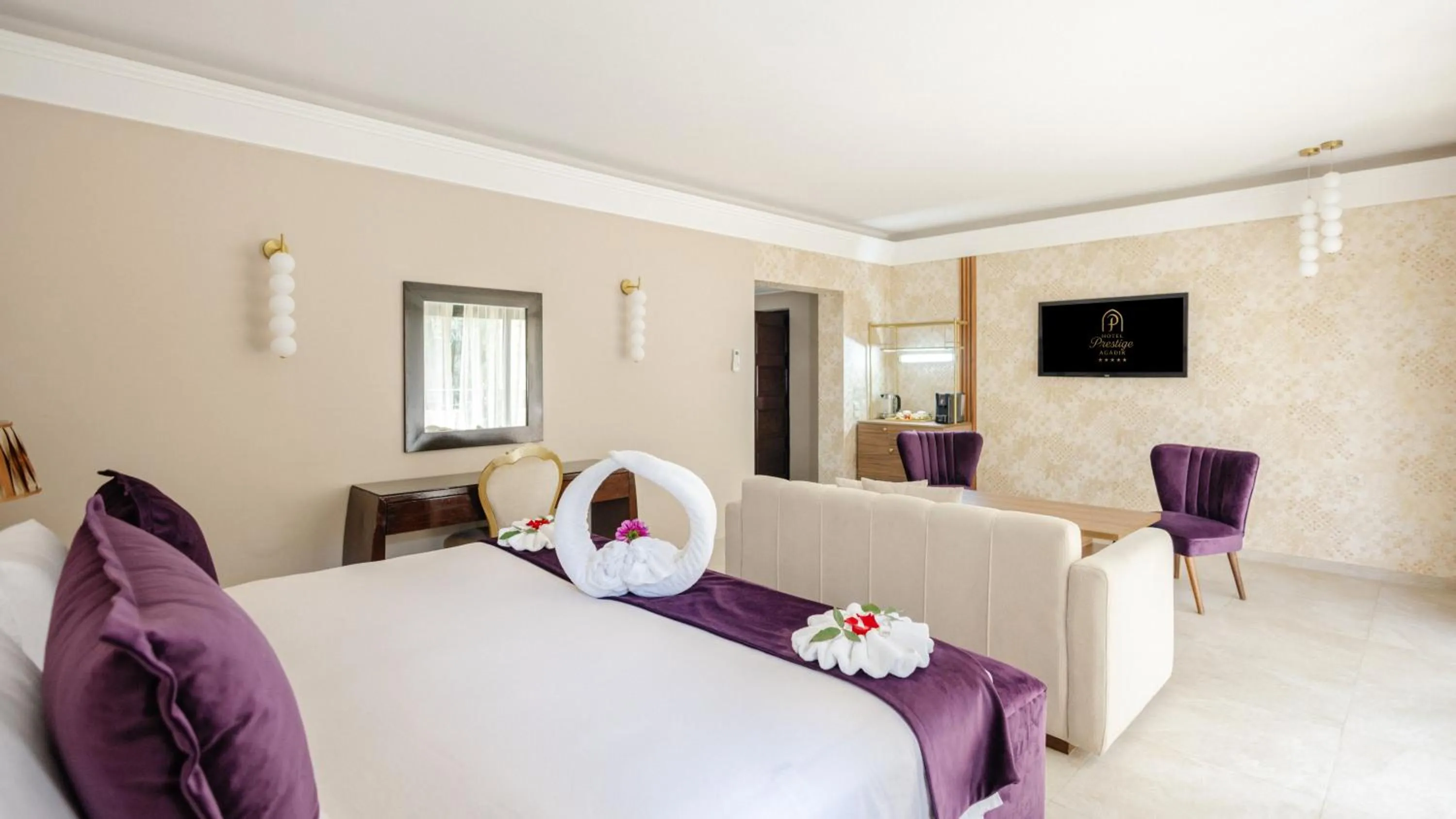 Communal lounge/ TV room, Bed in Hotel Prestige Agadir