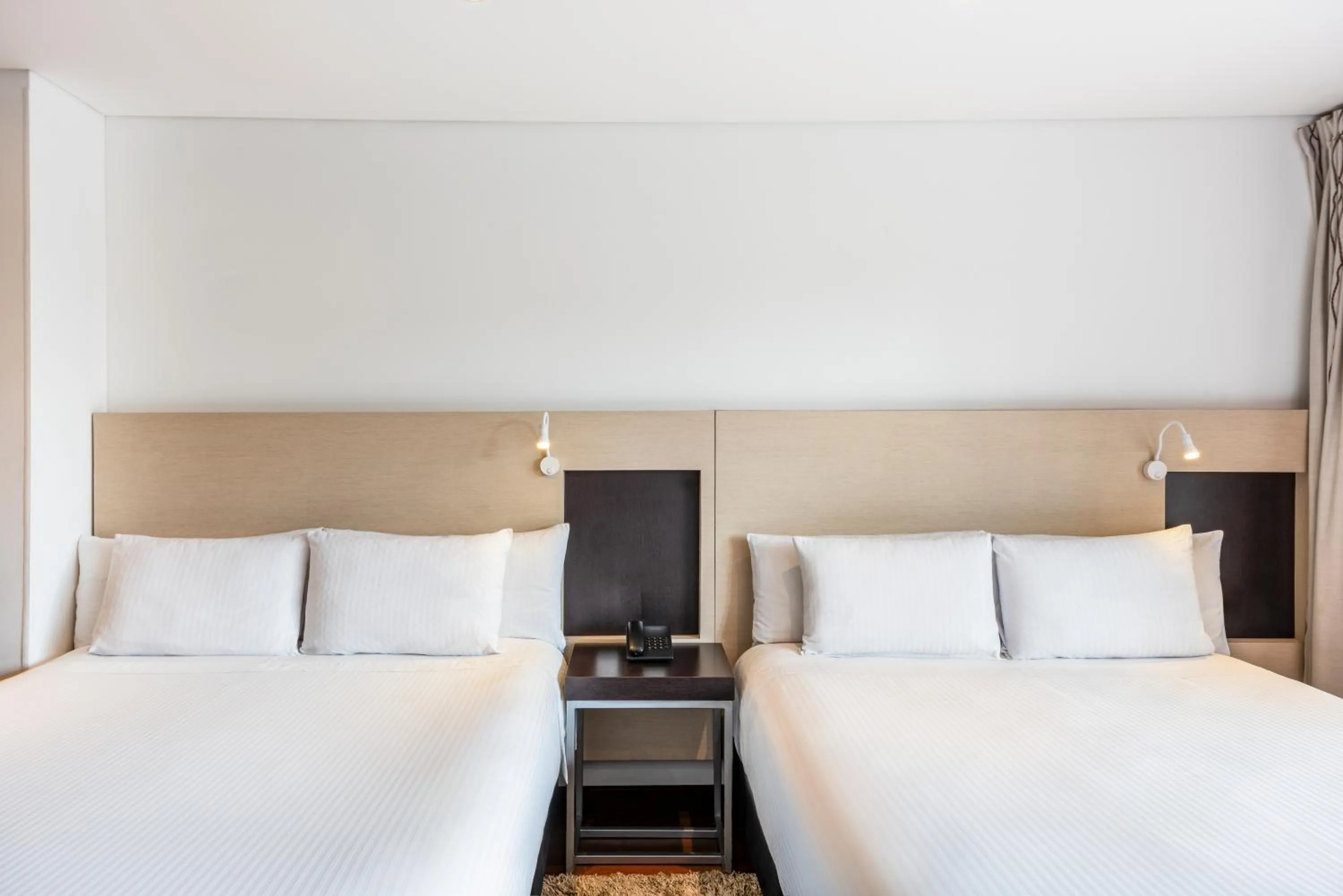 Bed in Hotel Jazz Apartments