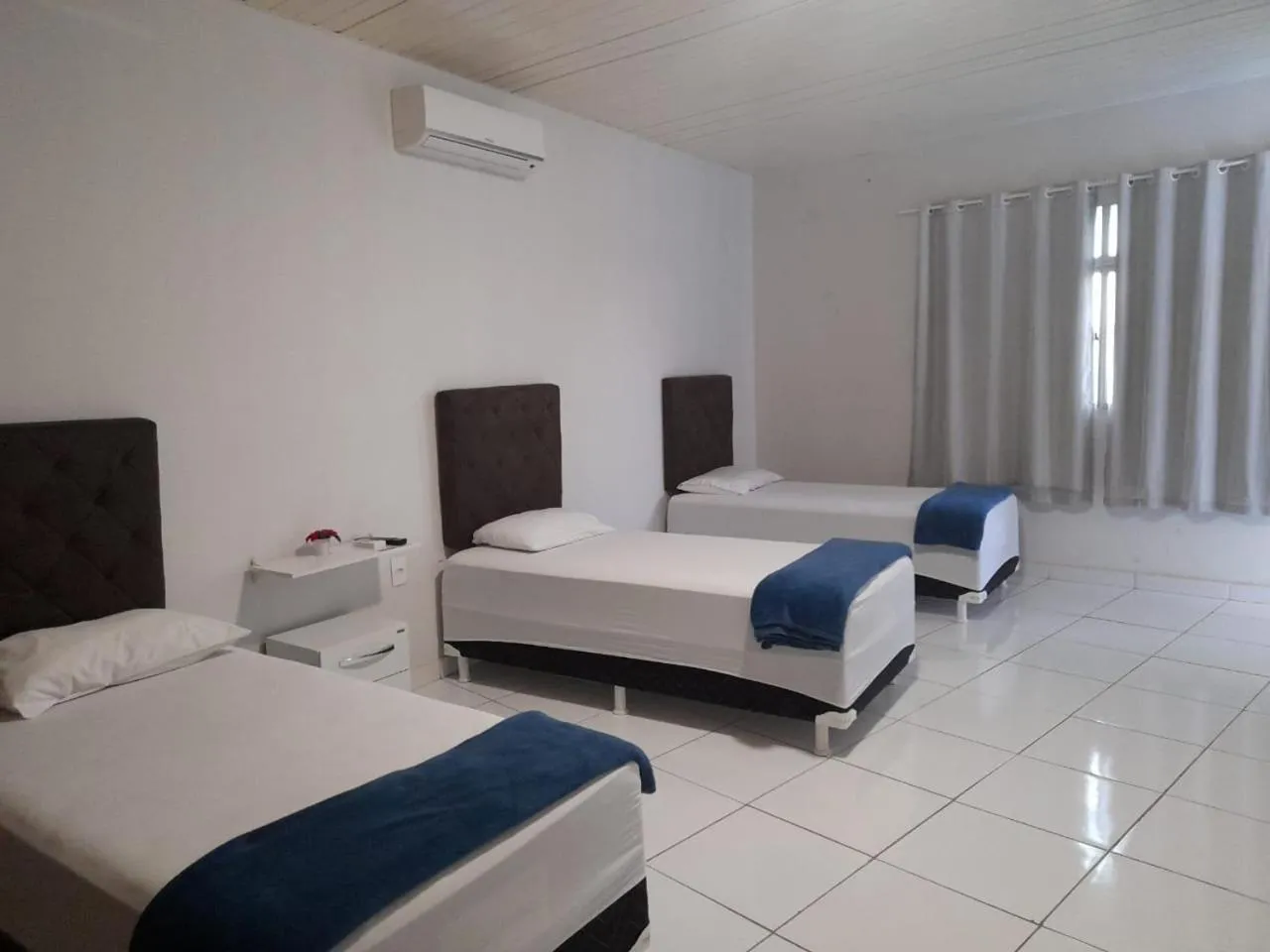 Bed in Pousada e Posto Amigão