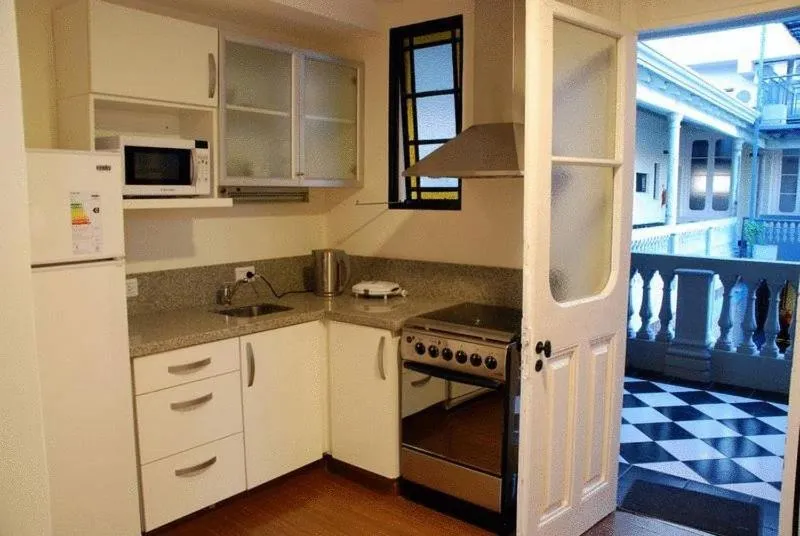 Kitchen or kitchenette in La Rozada Suites