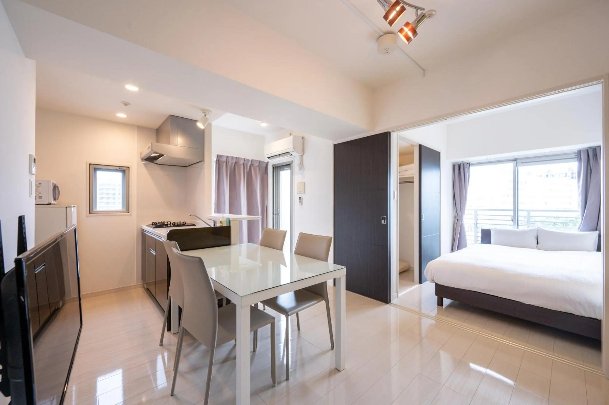 Living room, Bed in Residence Hotel Hakata 8