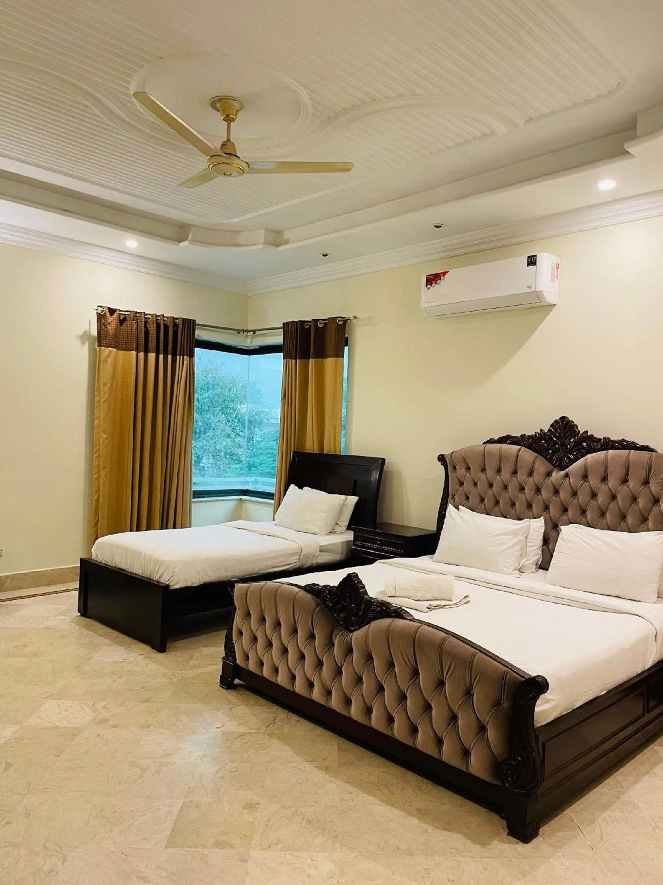 Photo of the whole room, Bed in Executive Galaxy Guest House Islamabad