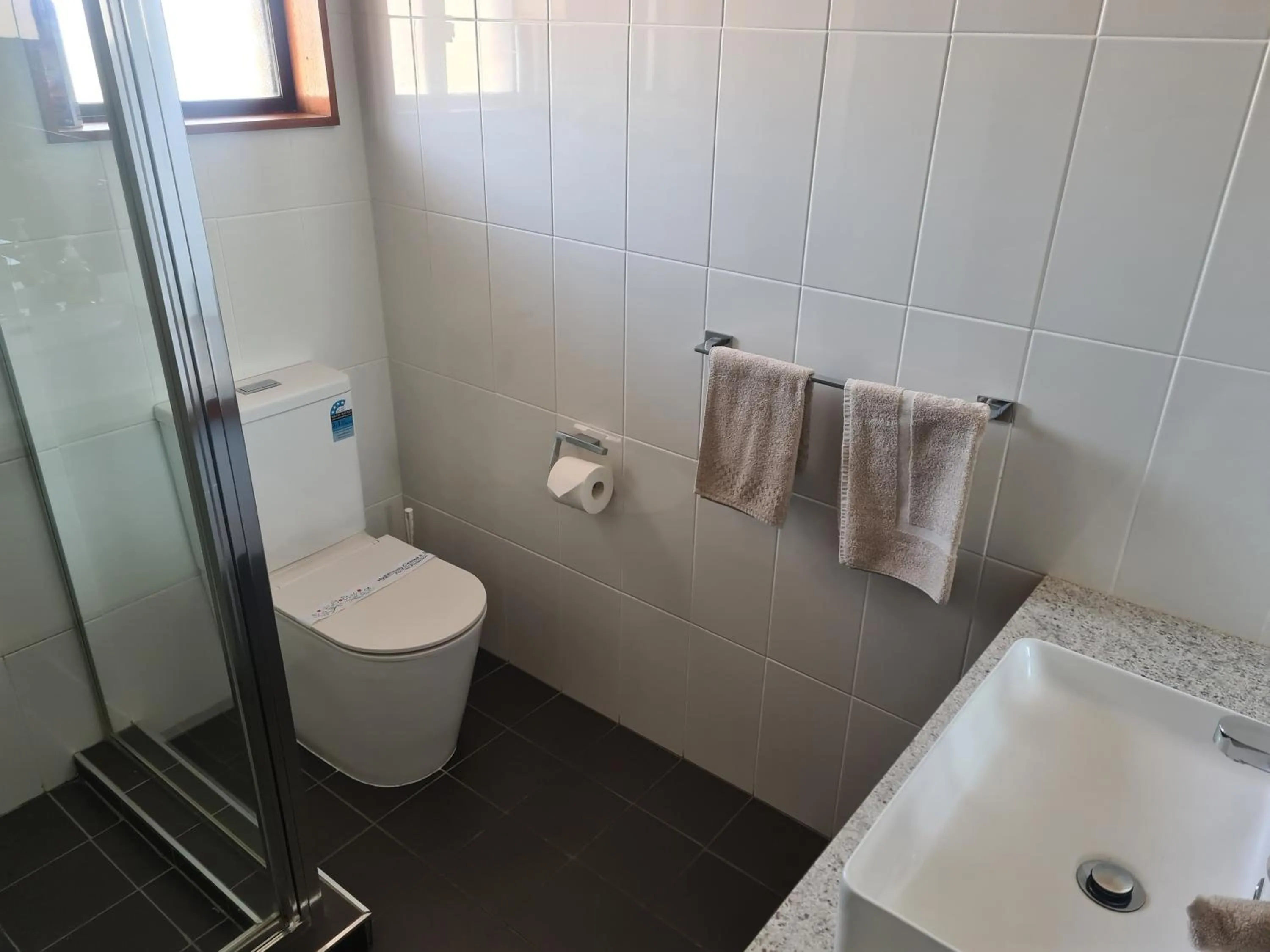 Toilet in Regency Court Motel