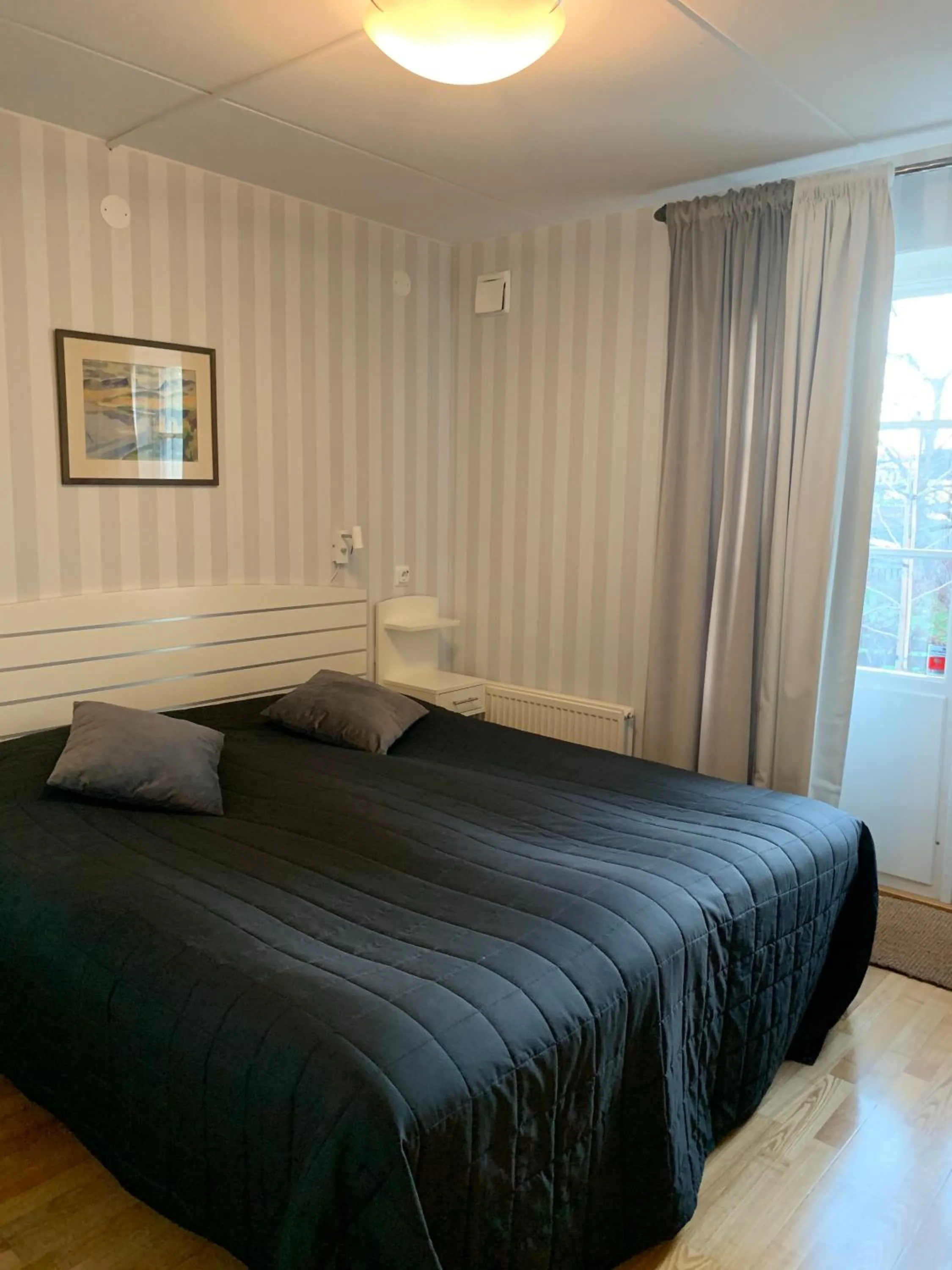 Bed in Nya Pallas Hotel