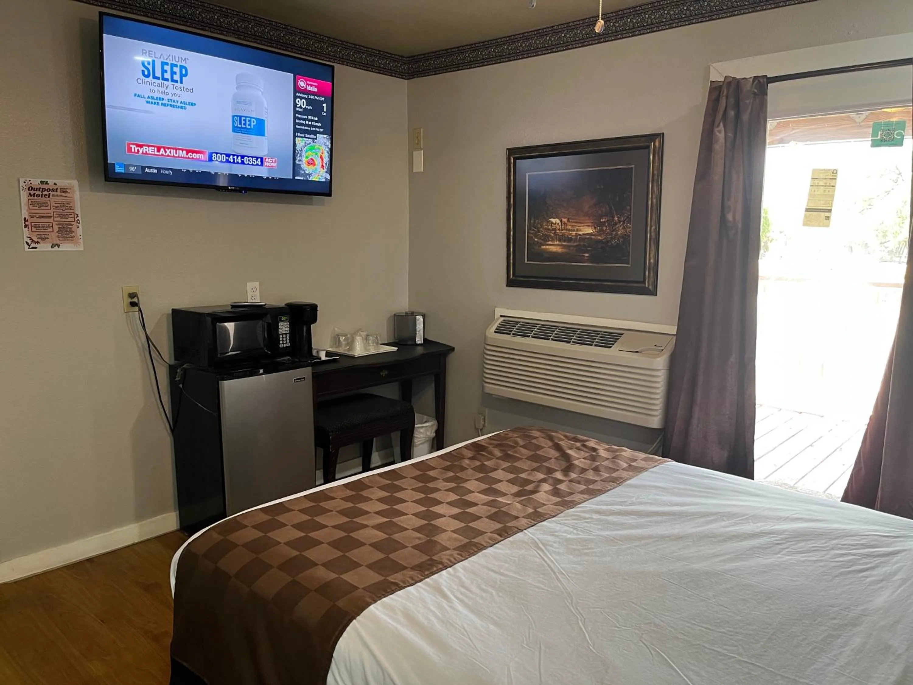 Bed in Outpost Motel