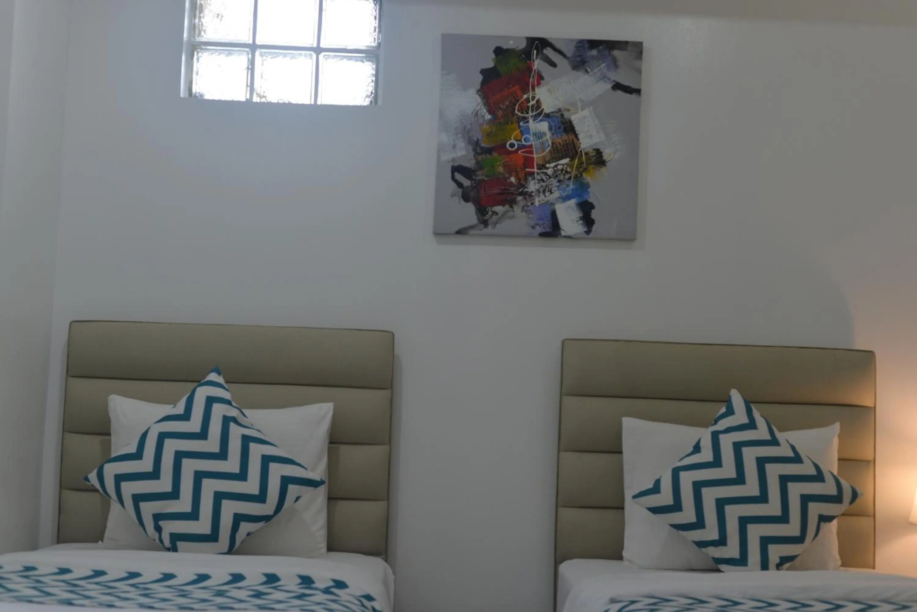 Bed in Grand Blue Beach Hotel