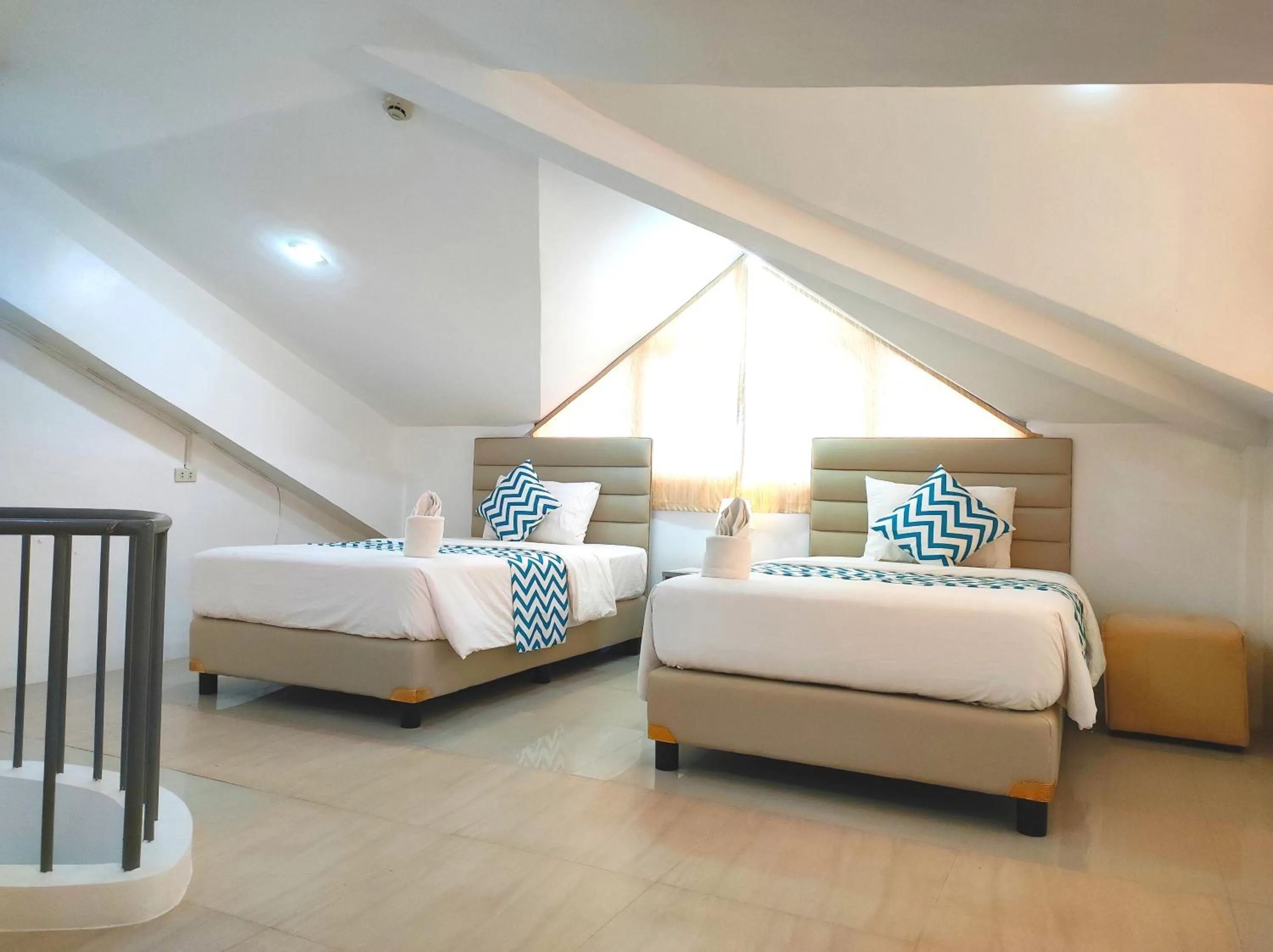 Bed in Grand Blue Beach Hotel