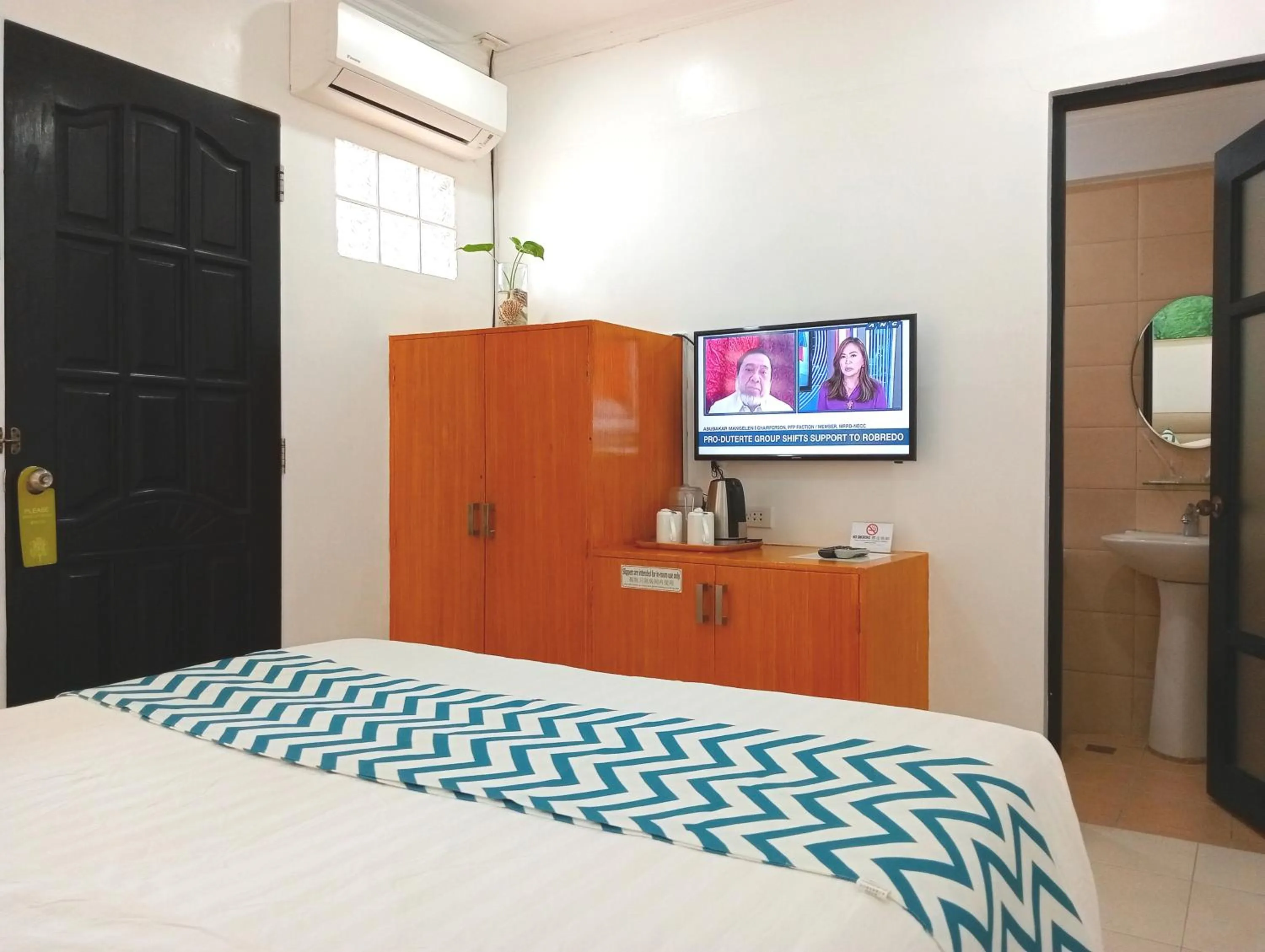 Bed in Grand Blue Beach Hotel