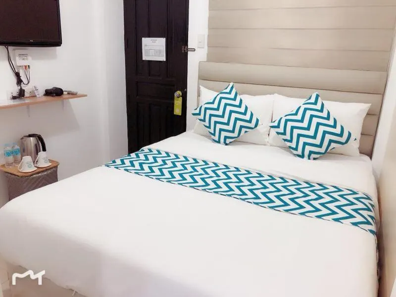 Bed in Grand Blue Beach Hotel