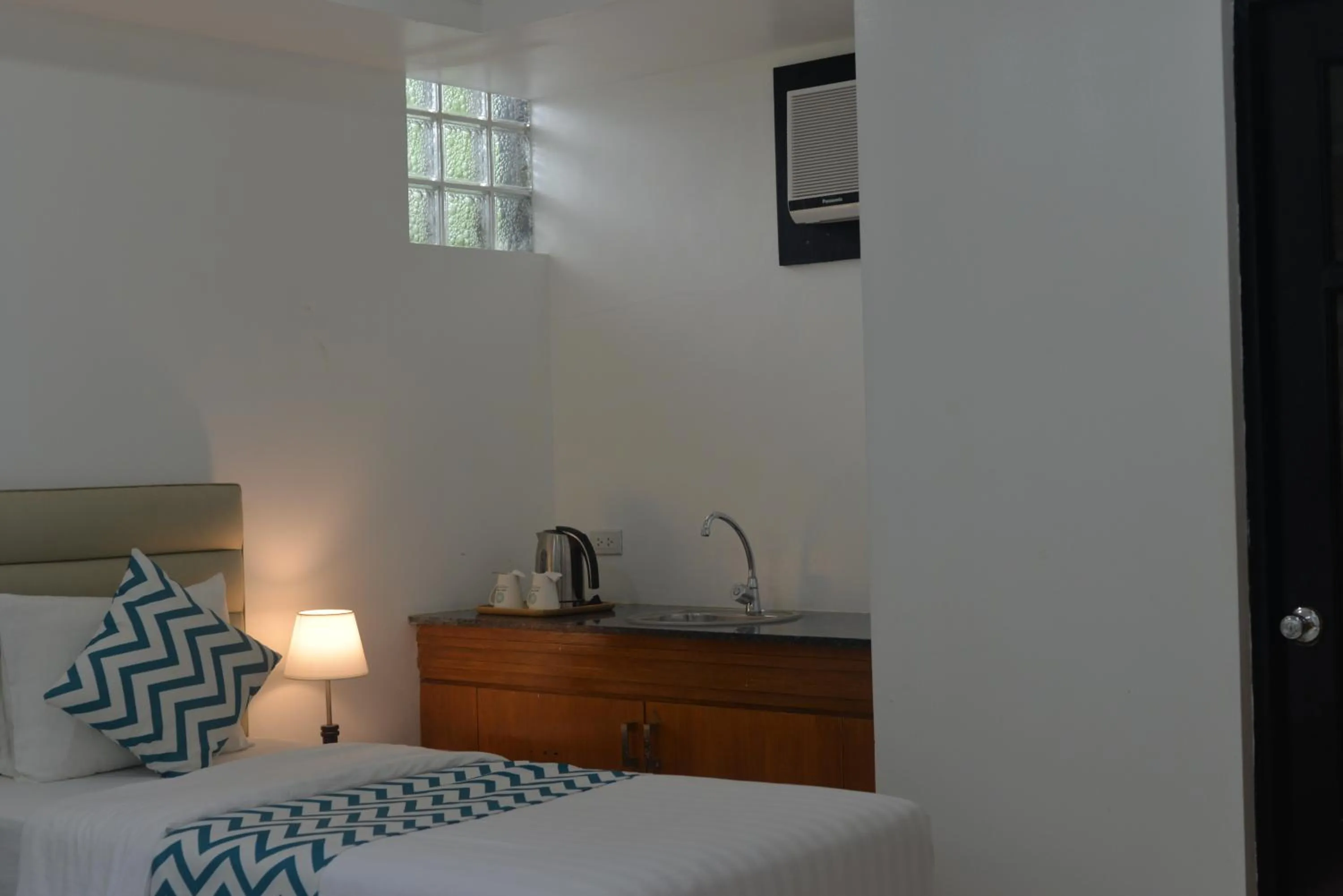 Bed in Grand Blue Beach Hotel