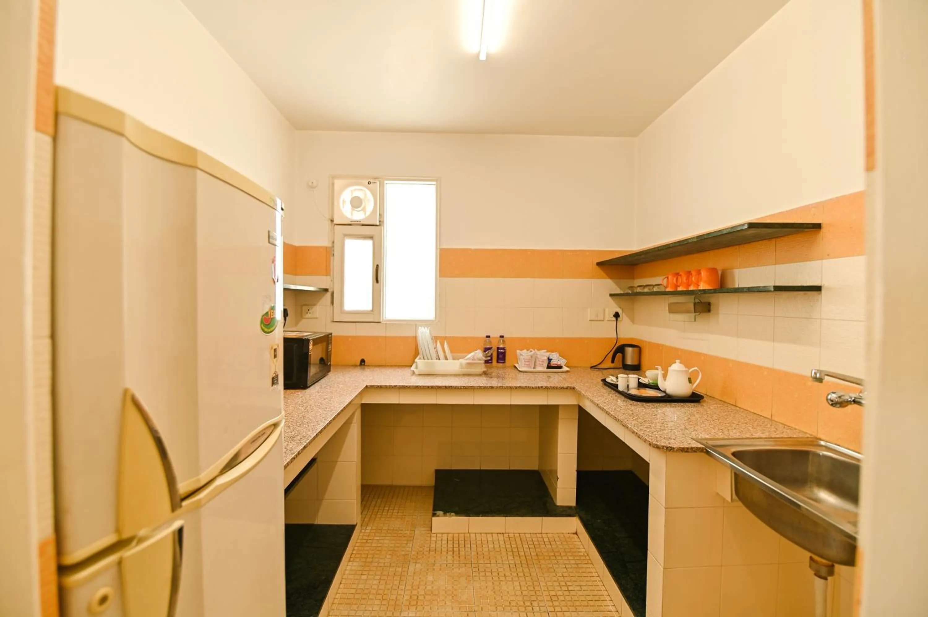 Kitchen or kitchenette in Om Niwas Suite Hotel