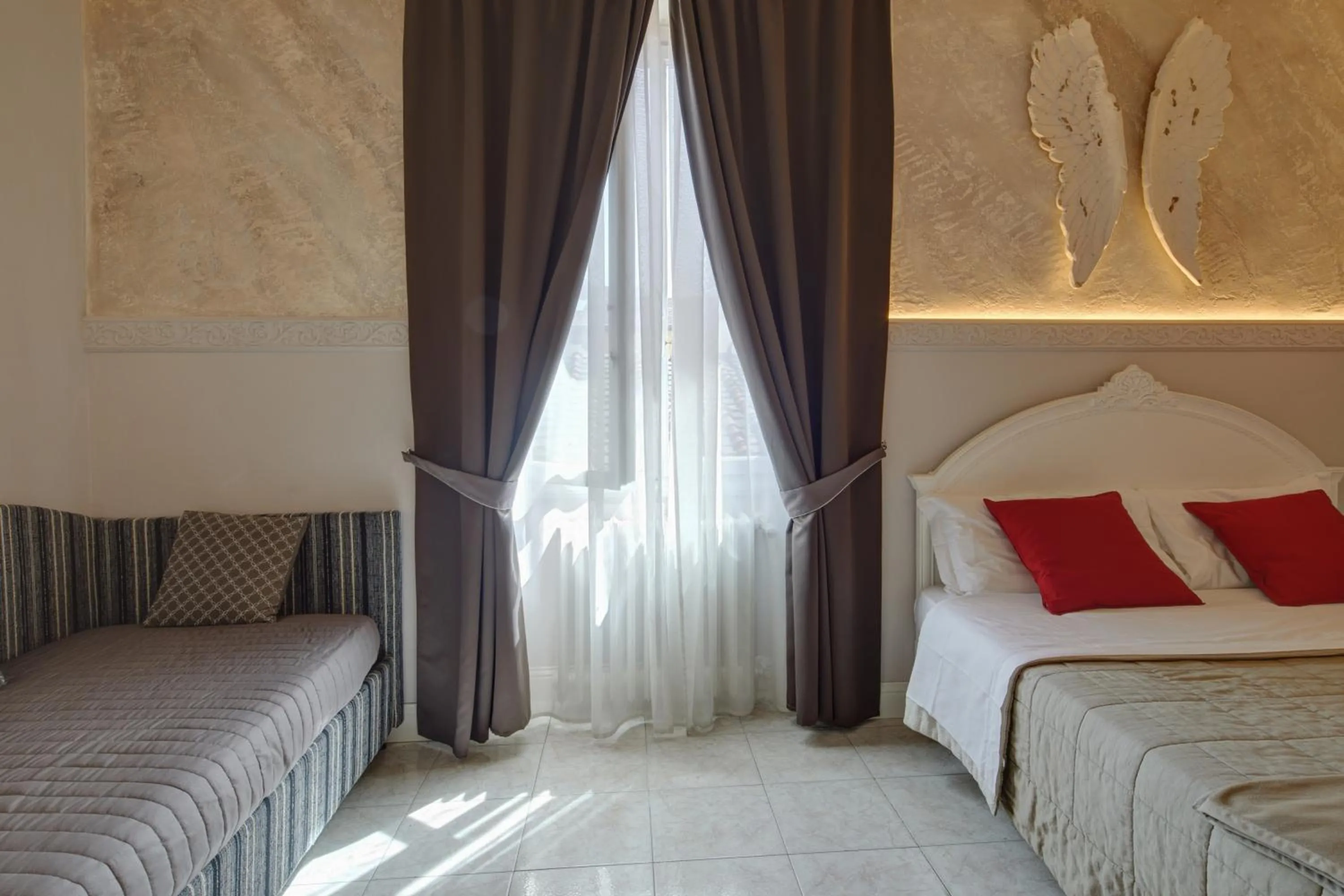 Bed in Leone X Guest House