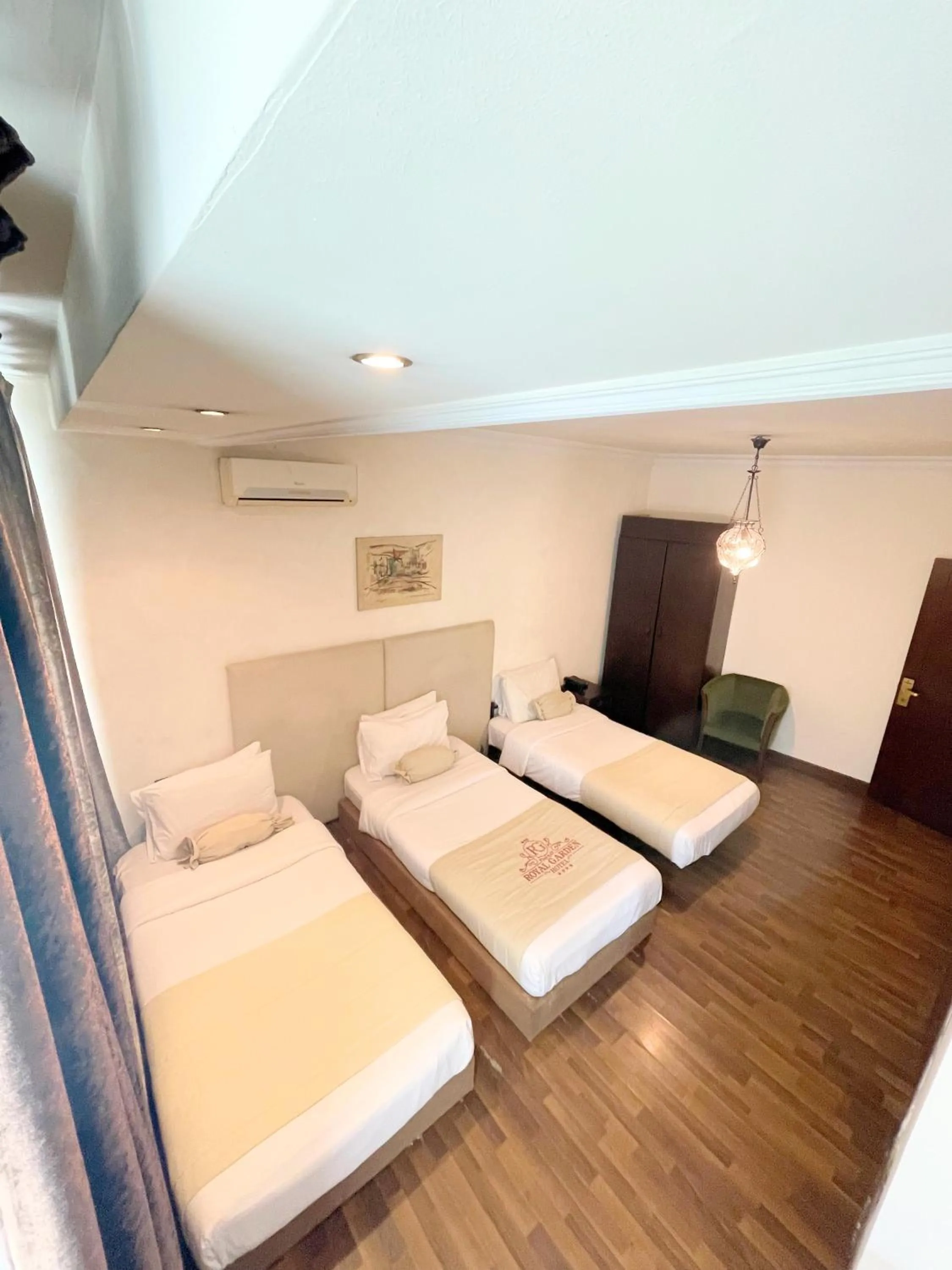 Bed in Royal Garden Hotel