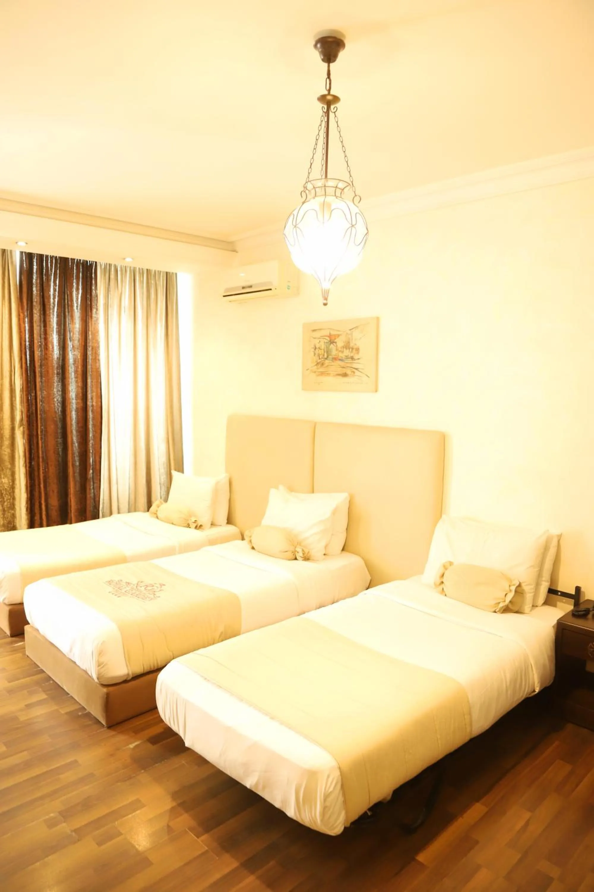 Bed in Royal Garden Hotel