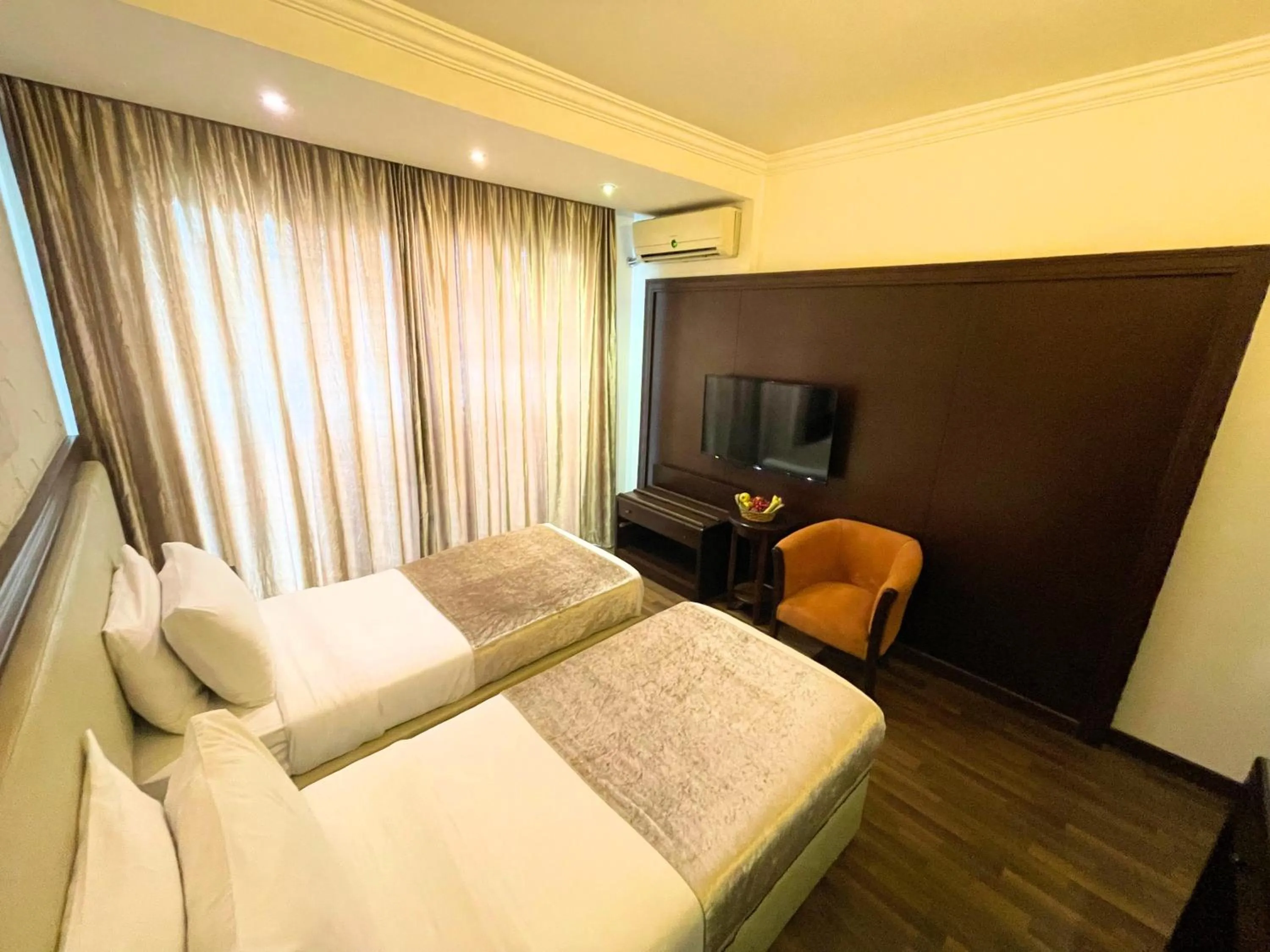 Bed in Royal Garden Hotel