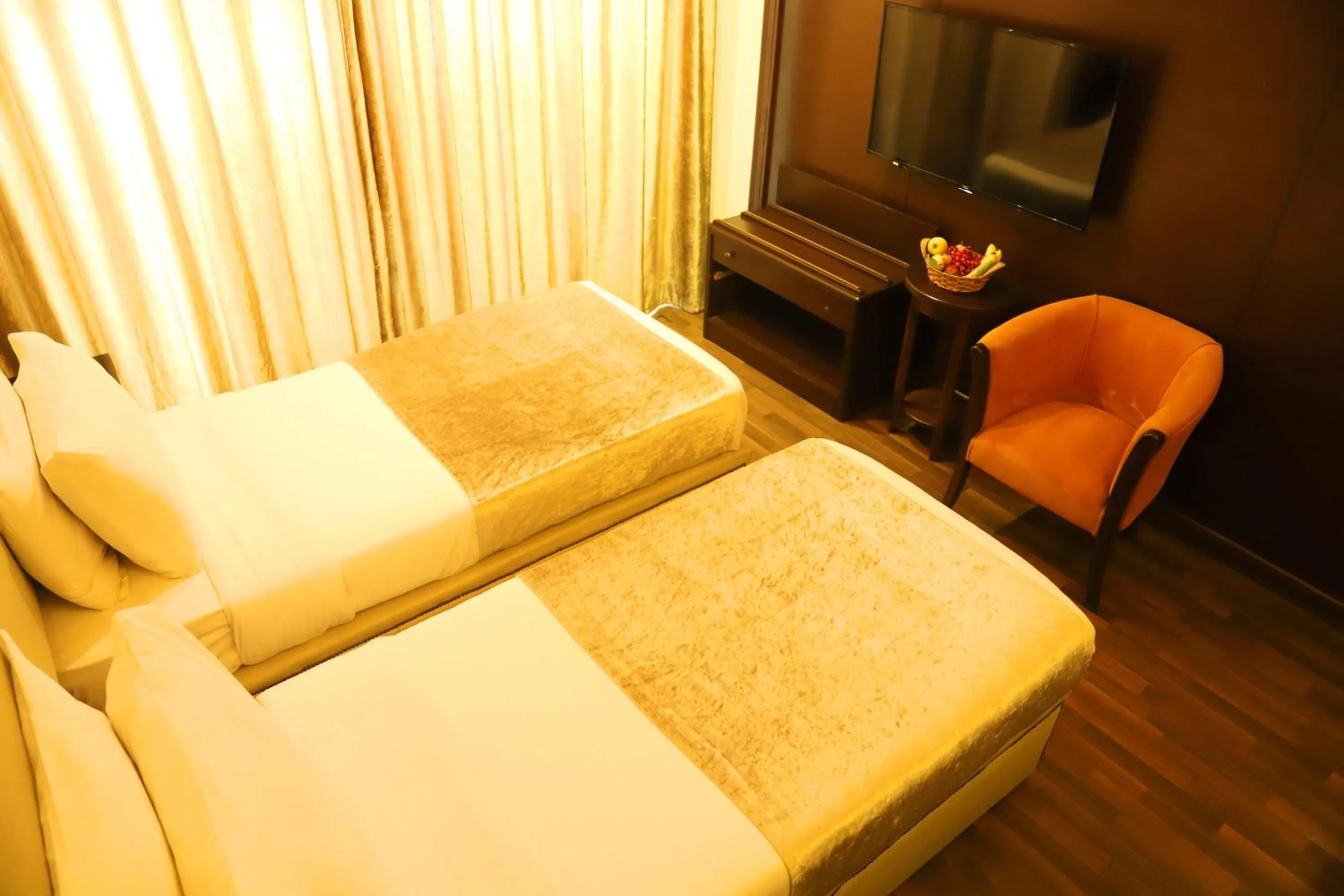 Bed in Royal Garden Hotel