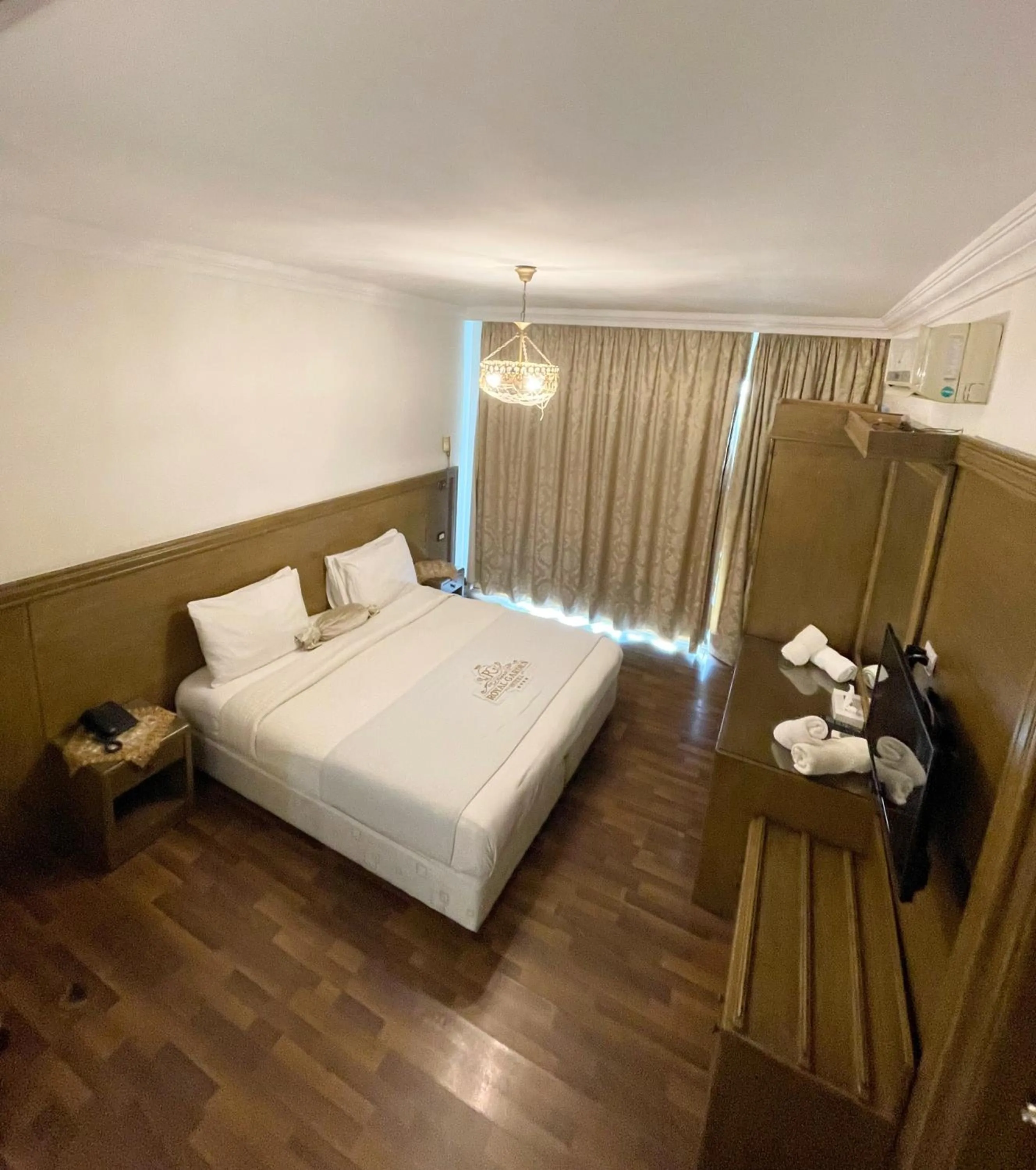 Bed in Royal Garden Hotel