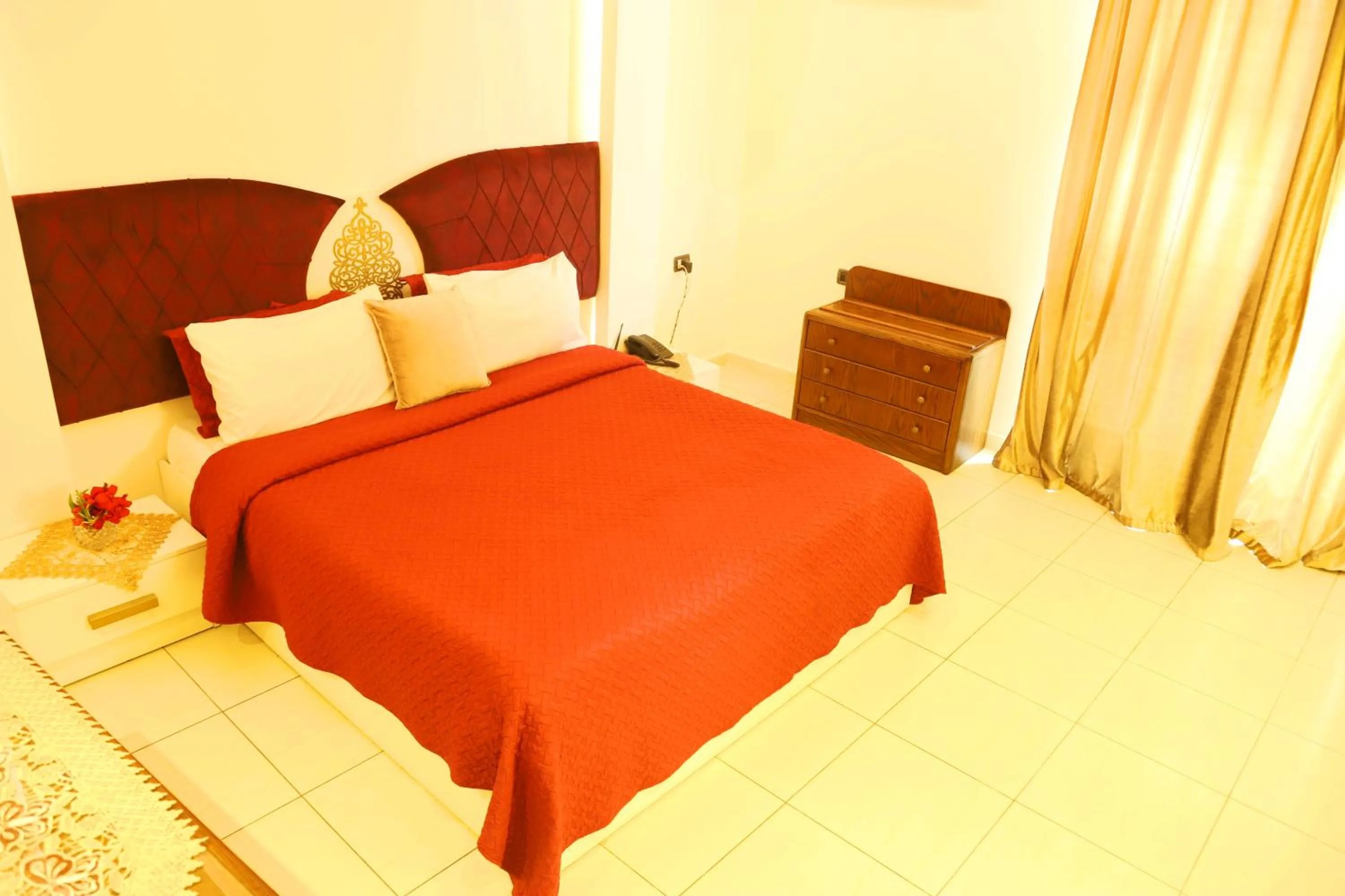 Bed in Royal Garden Hotel