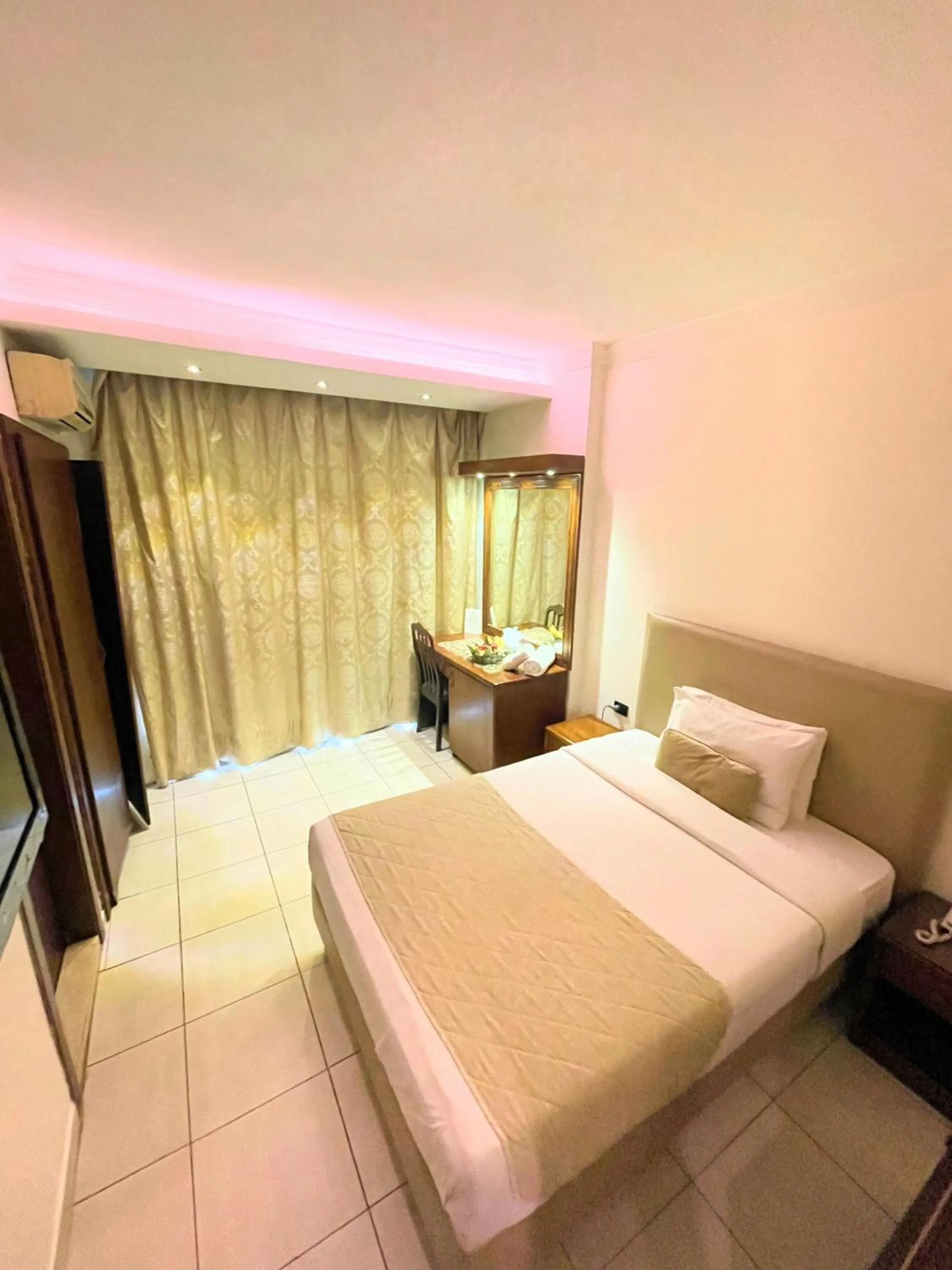 Bed in Royal Garden Hotel