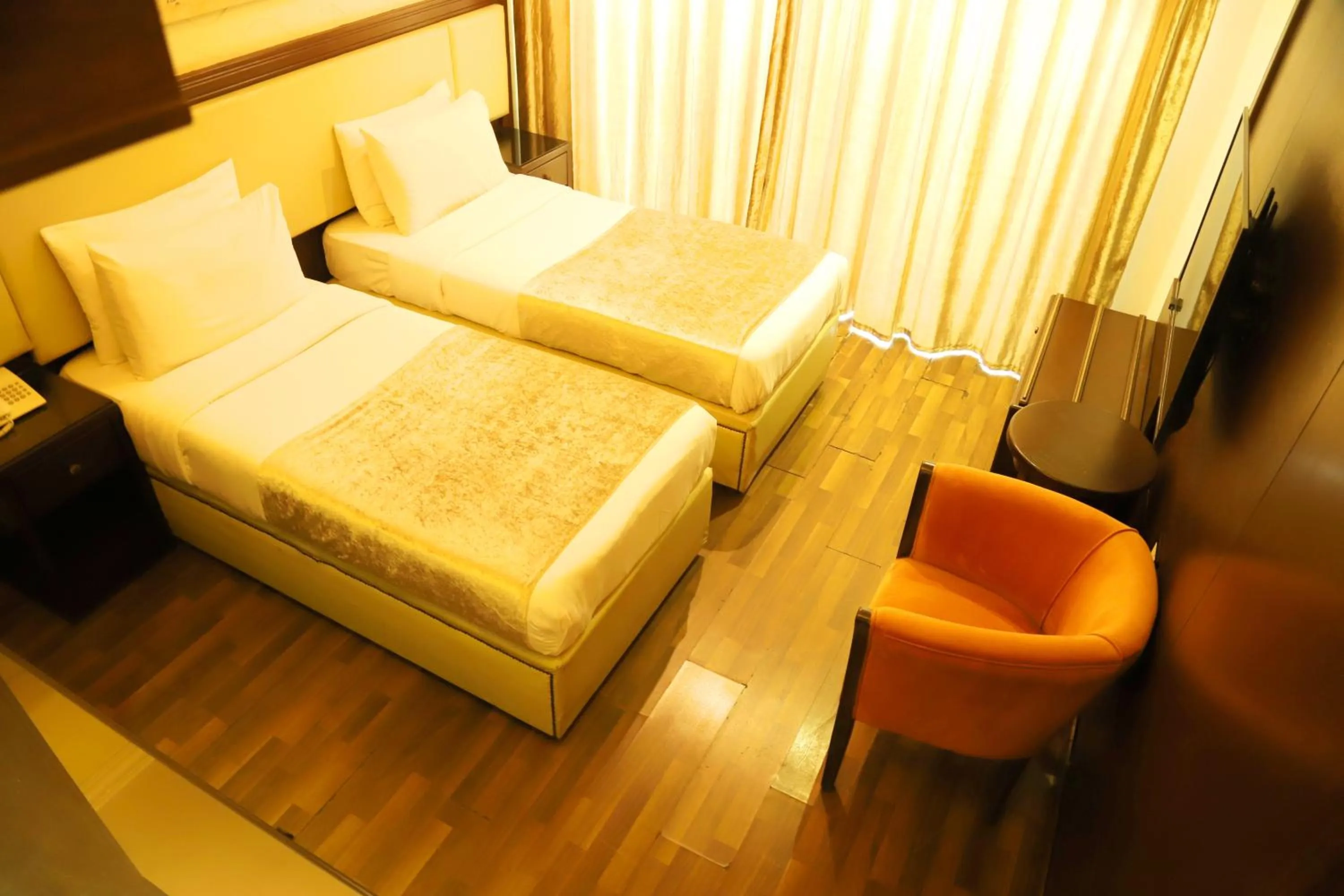 Bed in Royal Garden Hotel