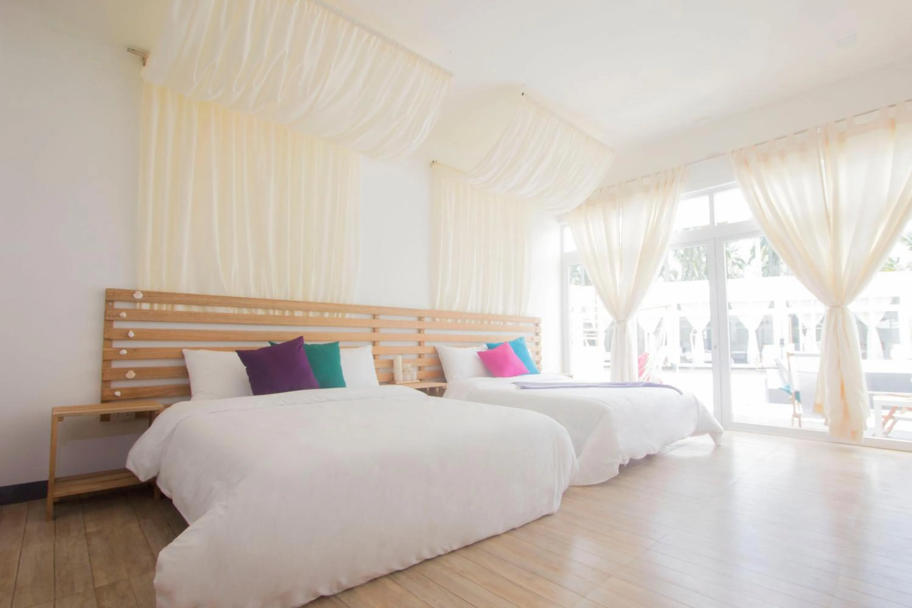 Bed in L'Sirene Boutique Resort