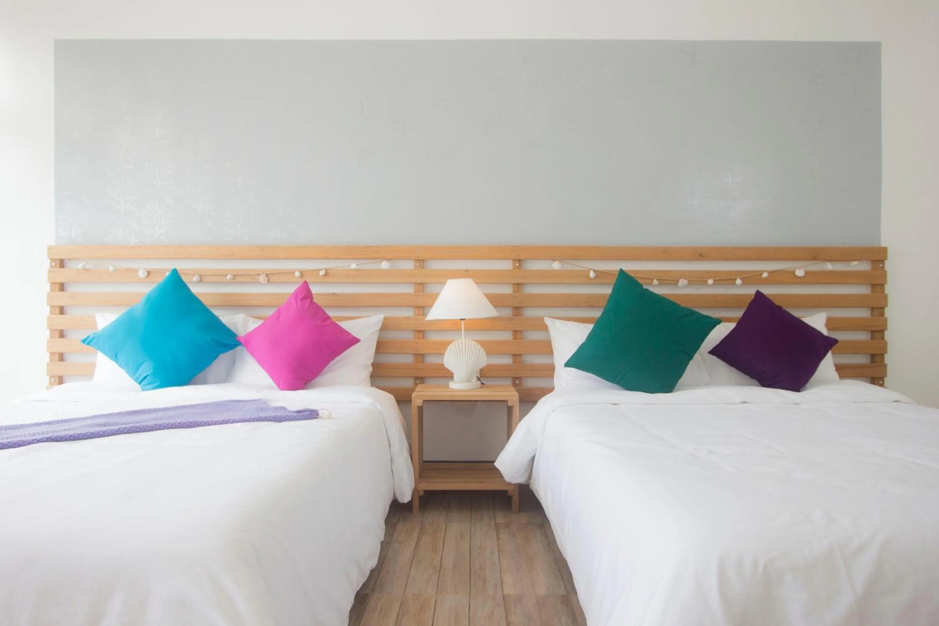 Bed in L'Sirene Boutique Resort