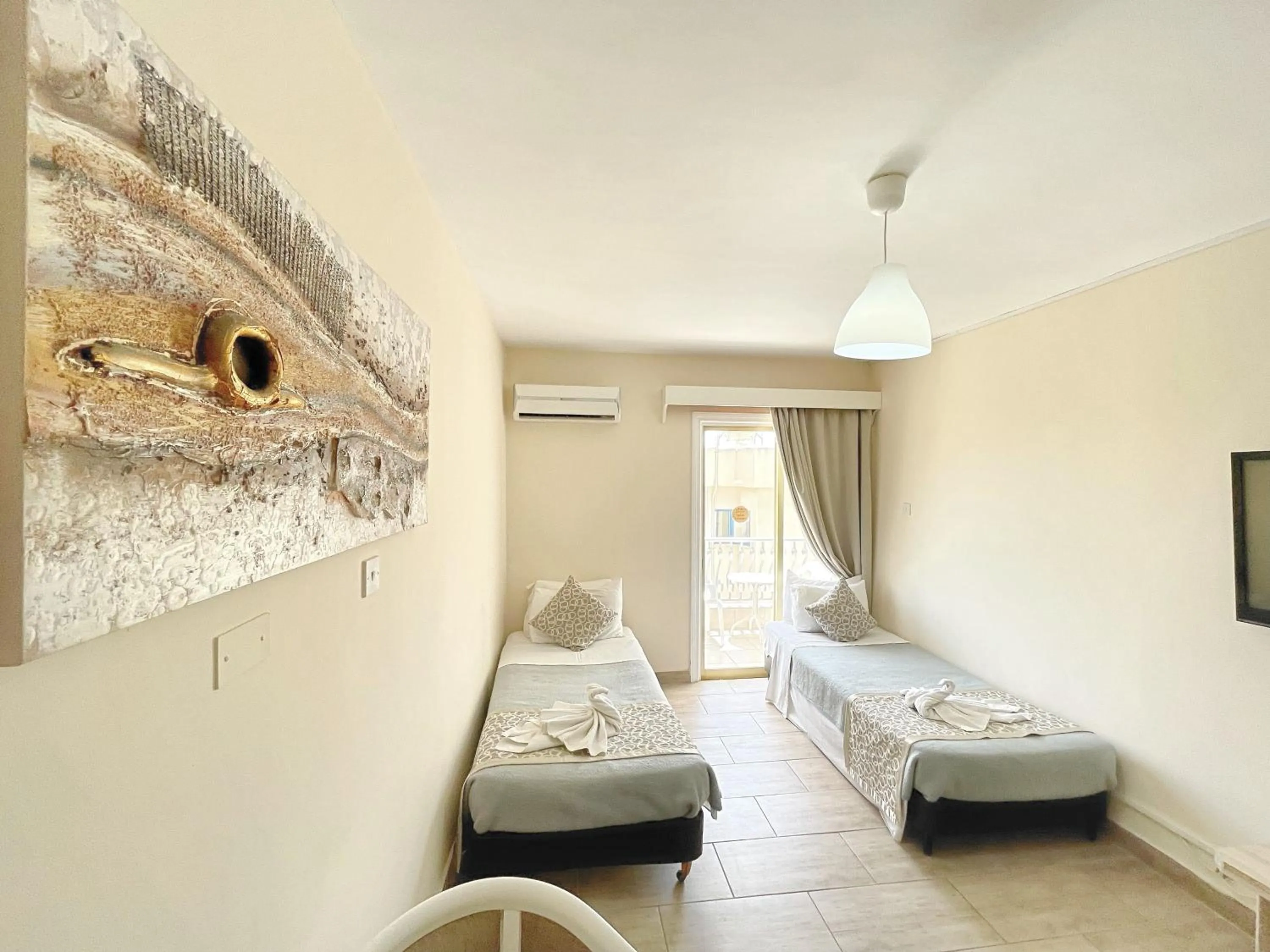 Bed in Antonis G. Hotel Apartments