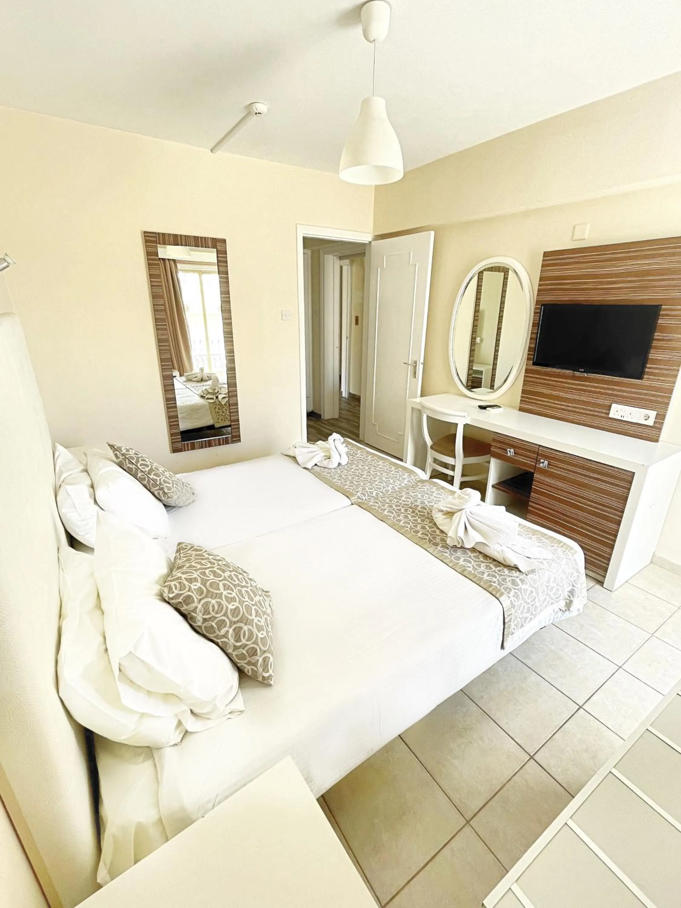 Bed in Antonis G. Hotel Apartments